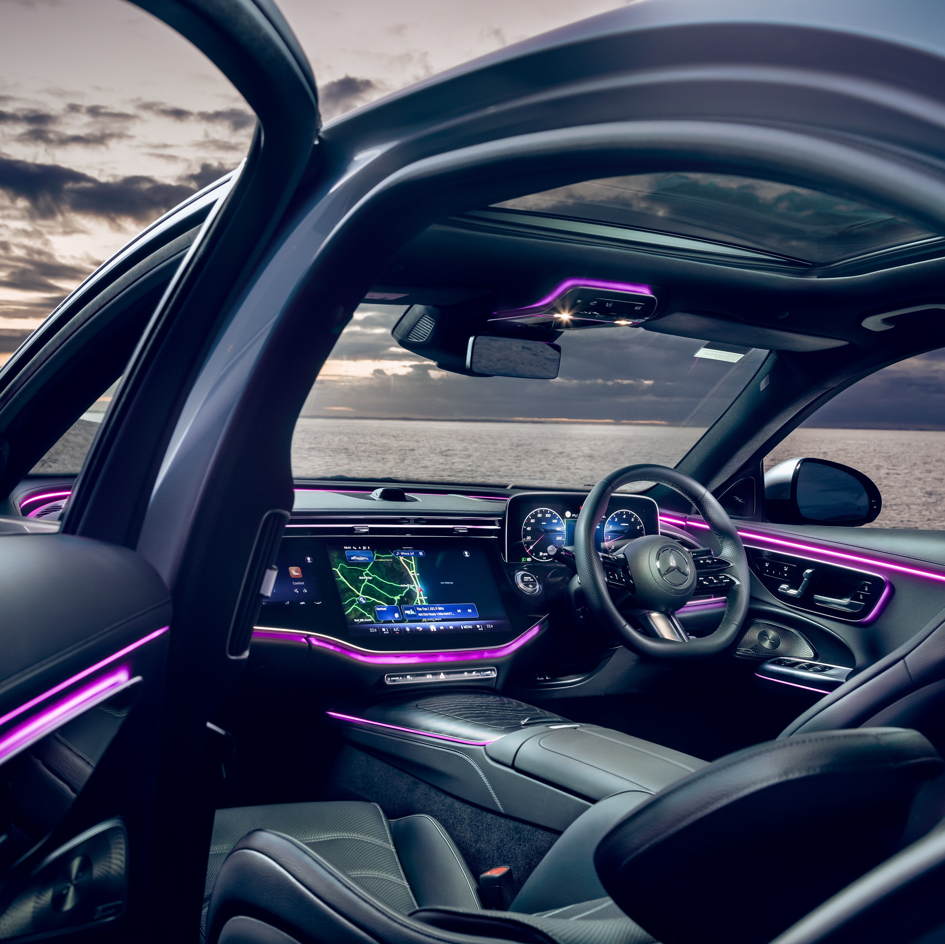 Interior of a Mercedes-Benz E-Class Sedan parked by water.