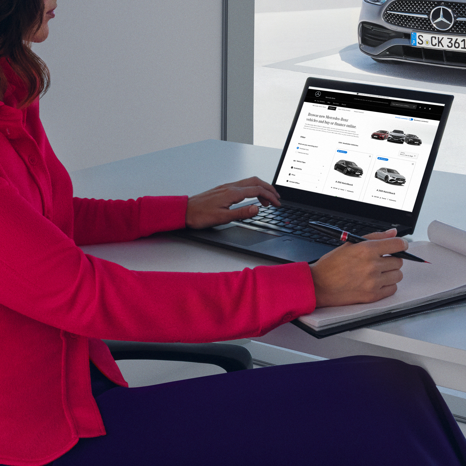 Mercedes-Benz Finance A person seated with her laptop
