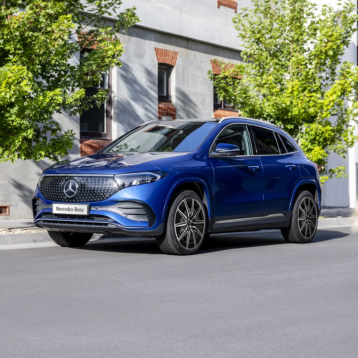 A blue EQA 250+ City Edition parked on the road side