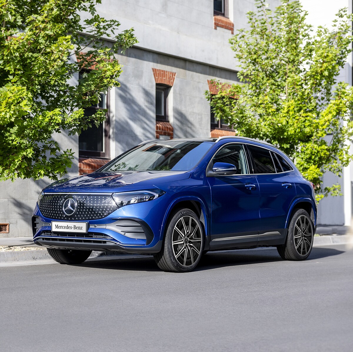 A blue EQA 250+ City Edition parked on the road side
