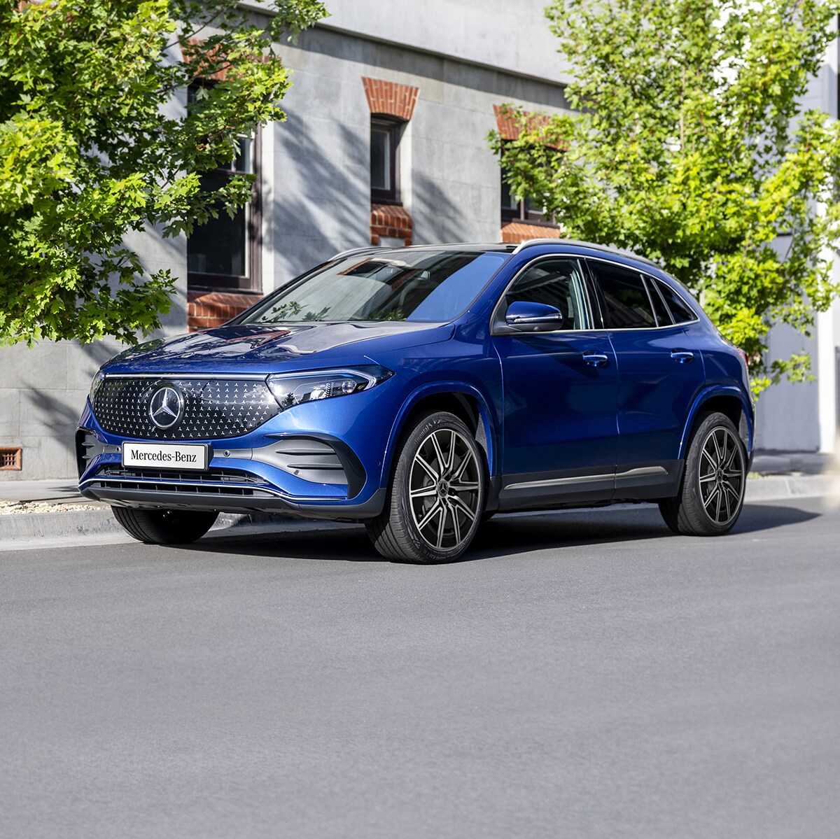 A blue EQA 250+ City Edition parked on the road side