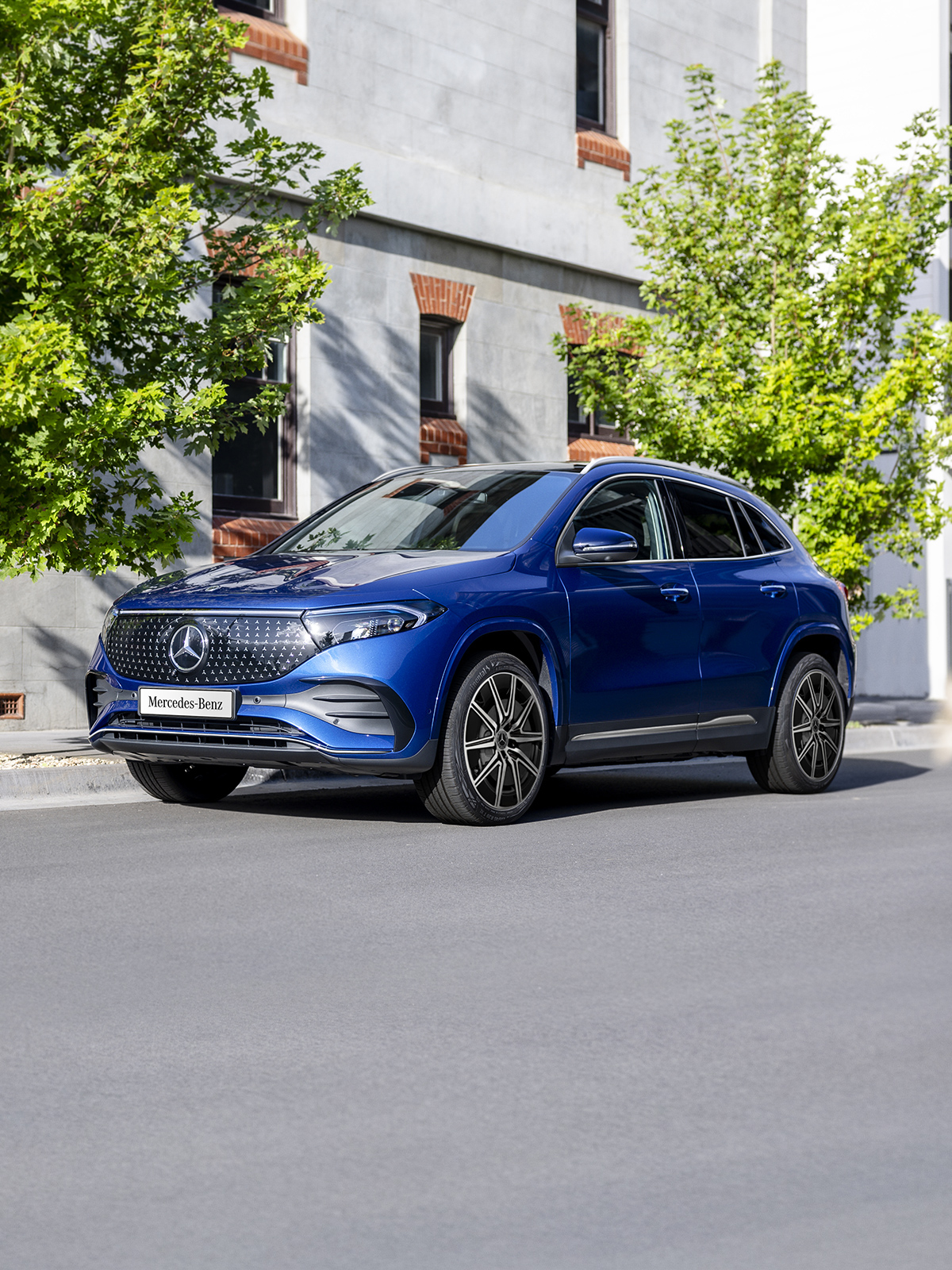 A blue EQA 250+ City Edition parked on the road side