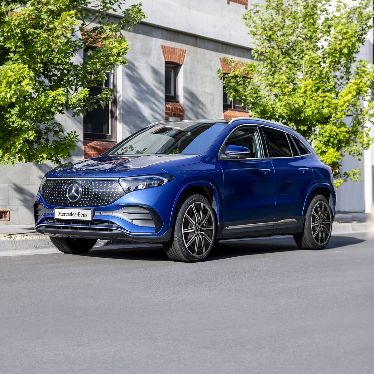 A blue EQA 250+ City Edition parked on the road side