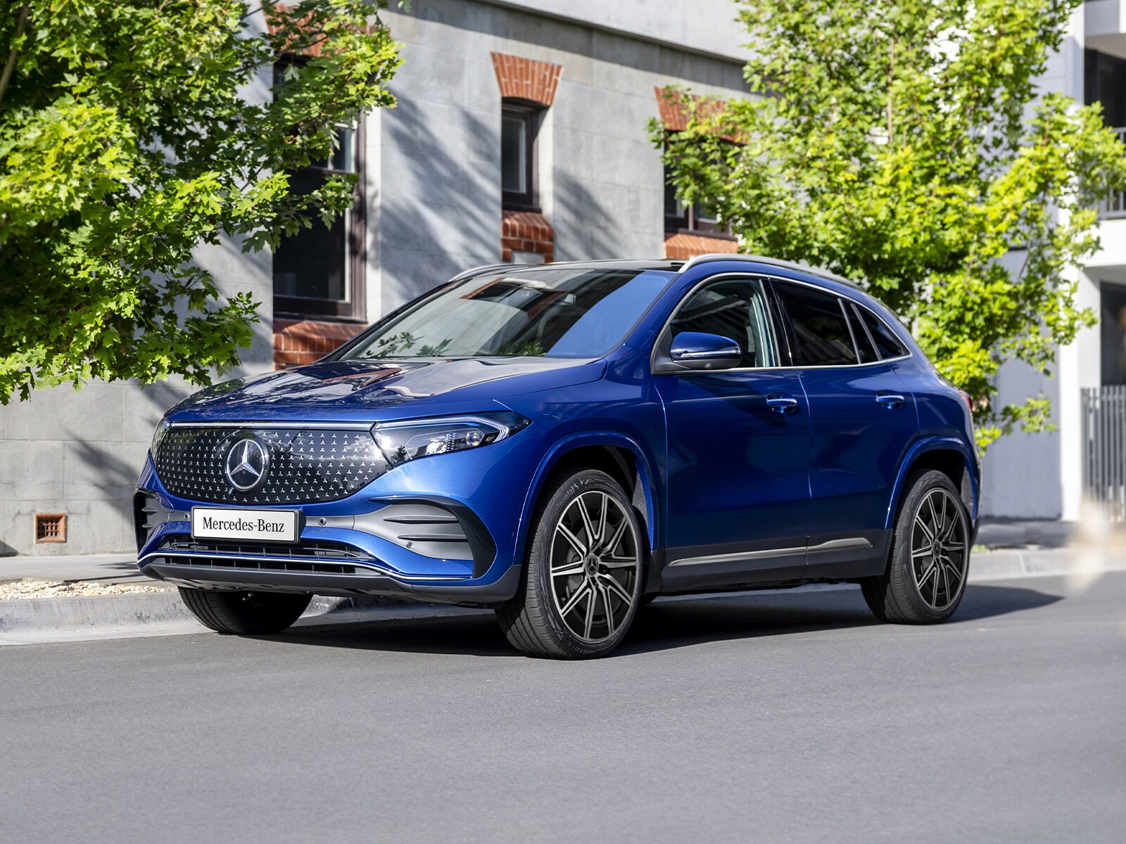 A blue EQA 250+ City Edition parked on the road side