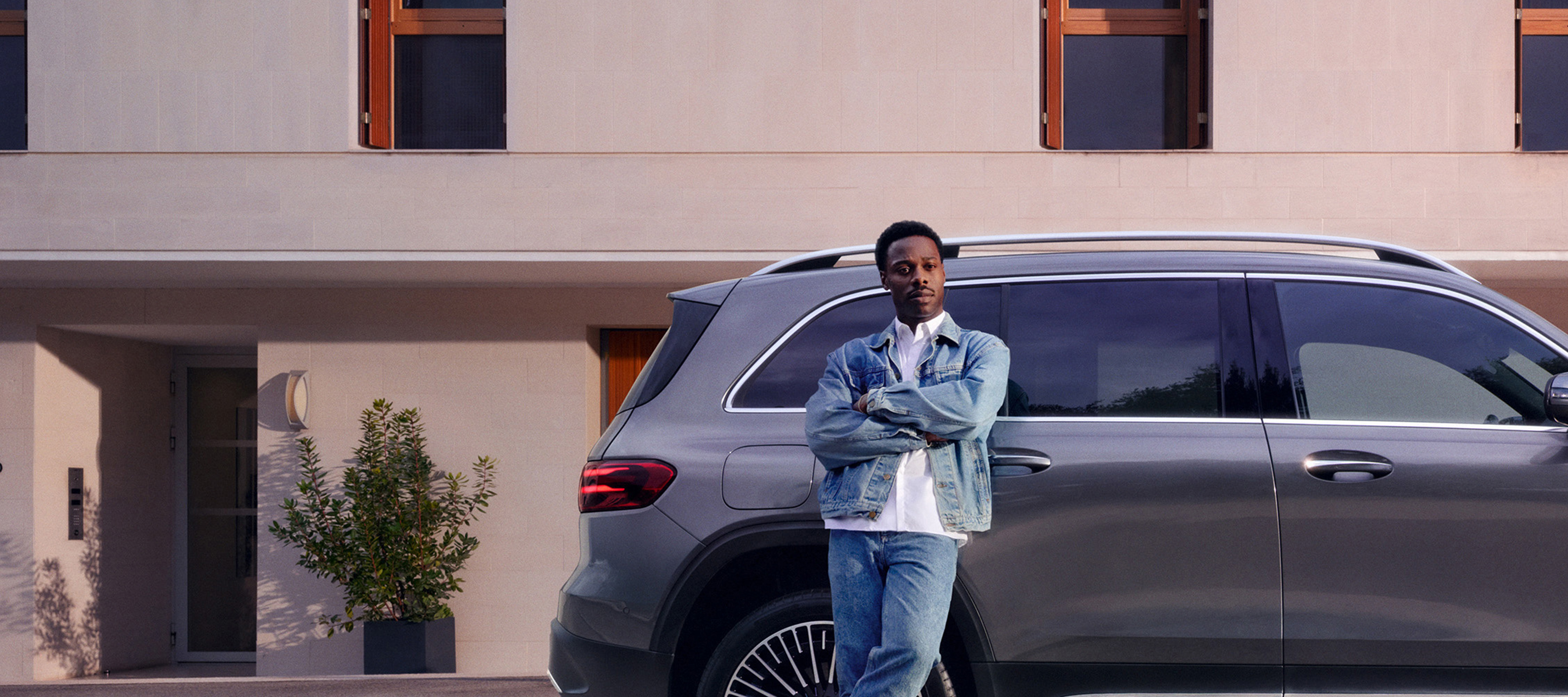 Be the master of your fate A man leaning against a car