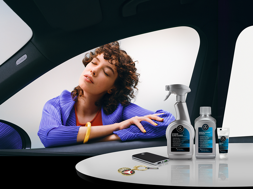 Mercedes-Benz Store This image shows the a woman and some Mercedes-Benz Store products