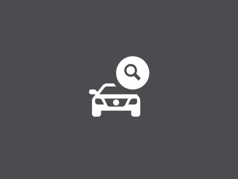 Icon of car with magnifying glass search symbol