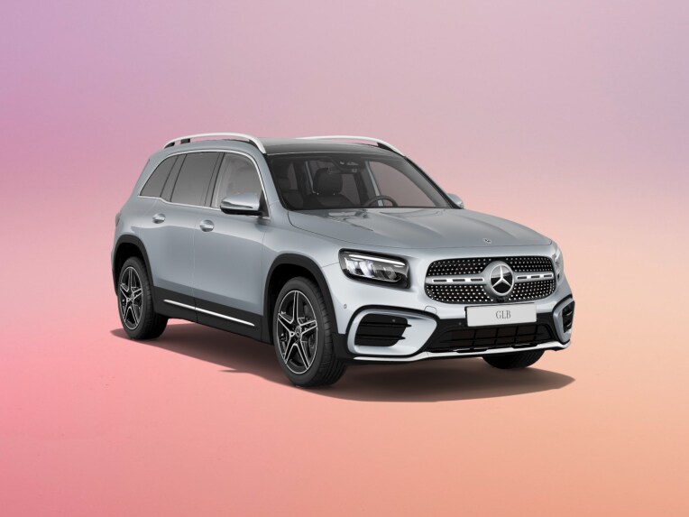 Silver GLB SUV on a pink background.