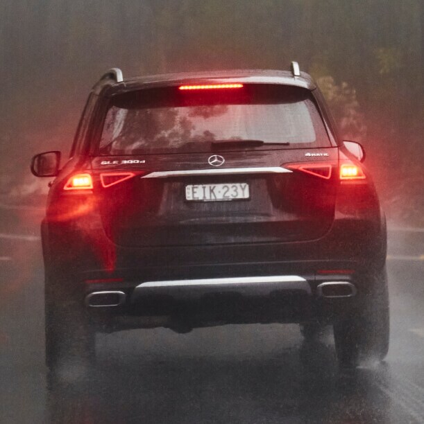 A car drives on a misty road