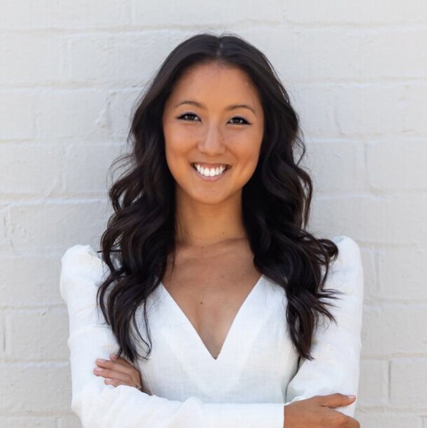 Sarah Davidson standing in front of a wall