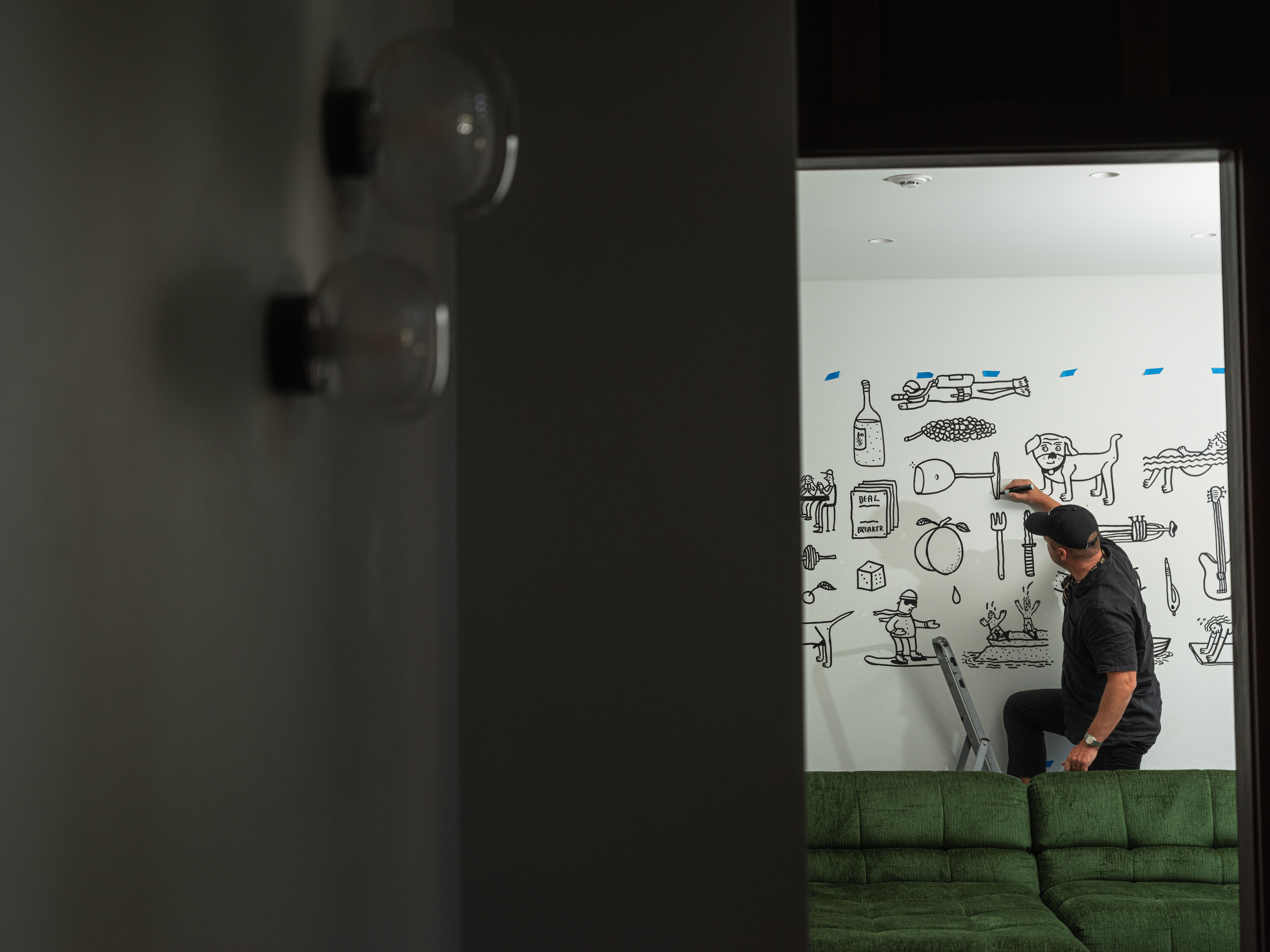 Artist Andrew J Steel drawing on a wall Artist Andrew J Steel drawing on a wall