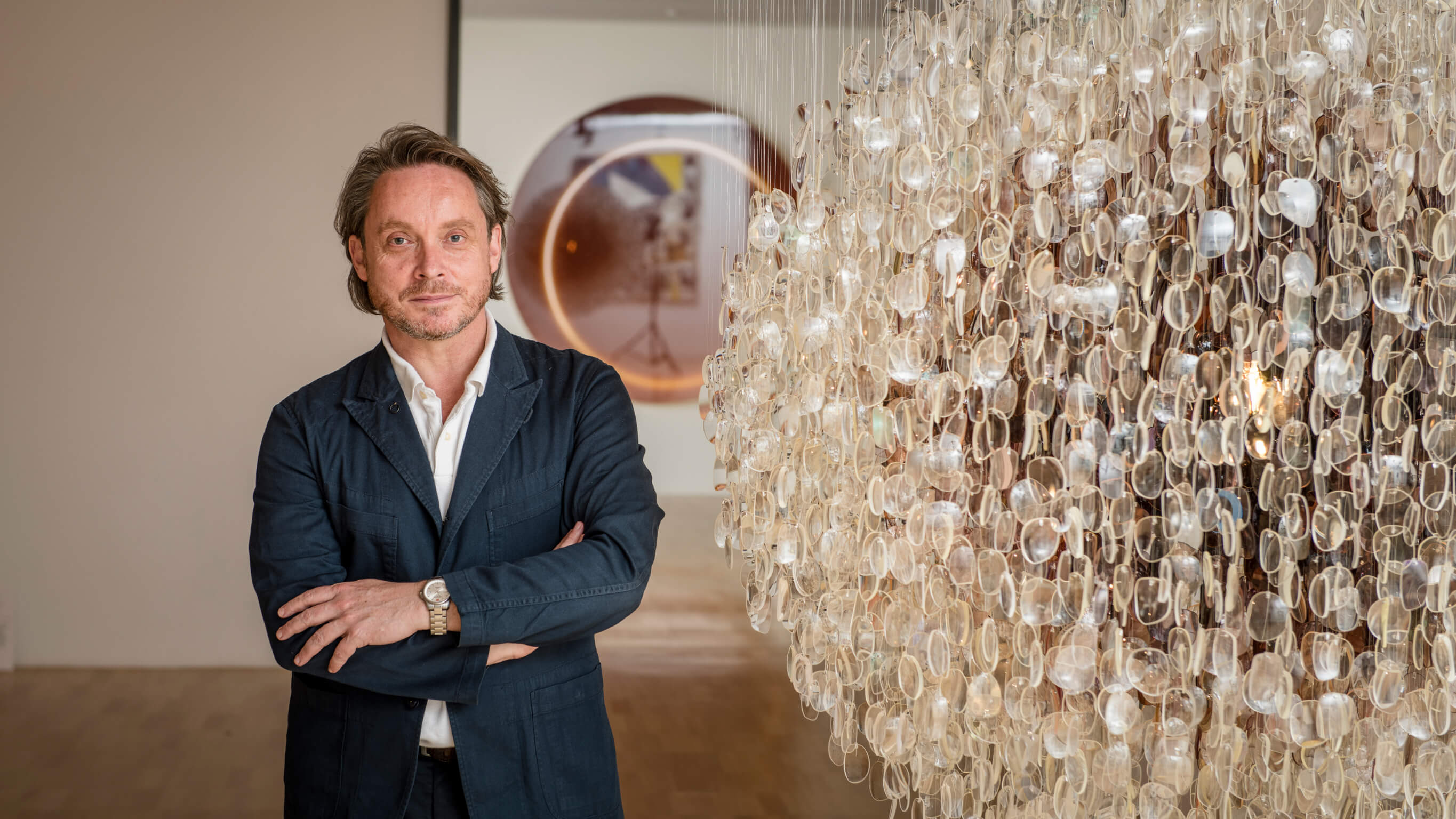 Tony Ellwood NGV director Tony Ellwood AM next to artwork