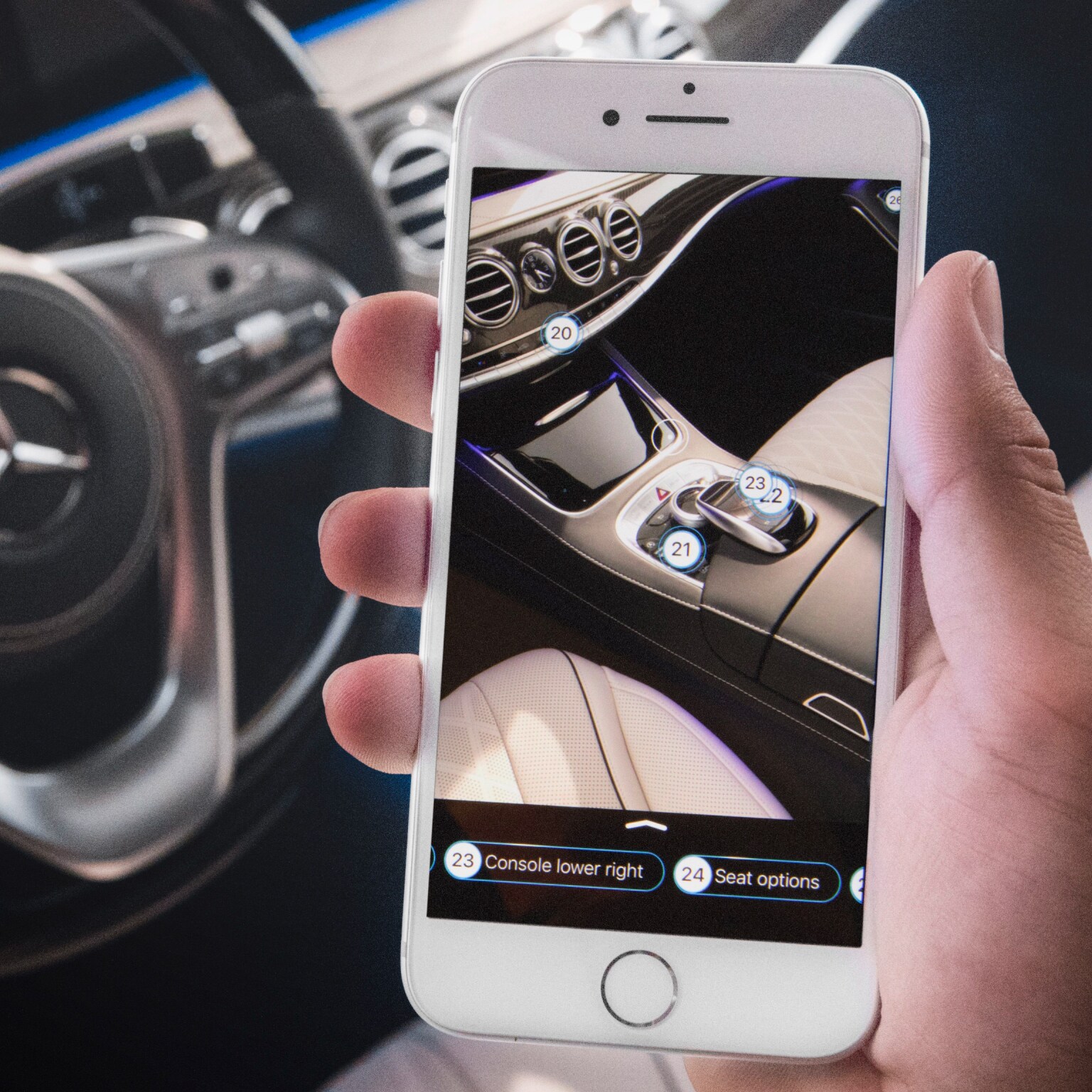 A steering wheel and a mobile phone