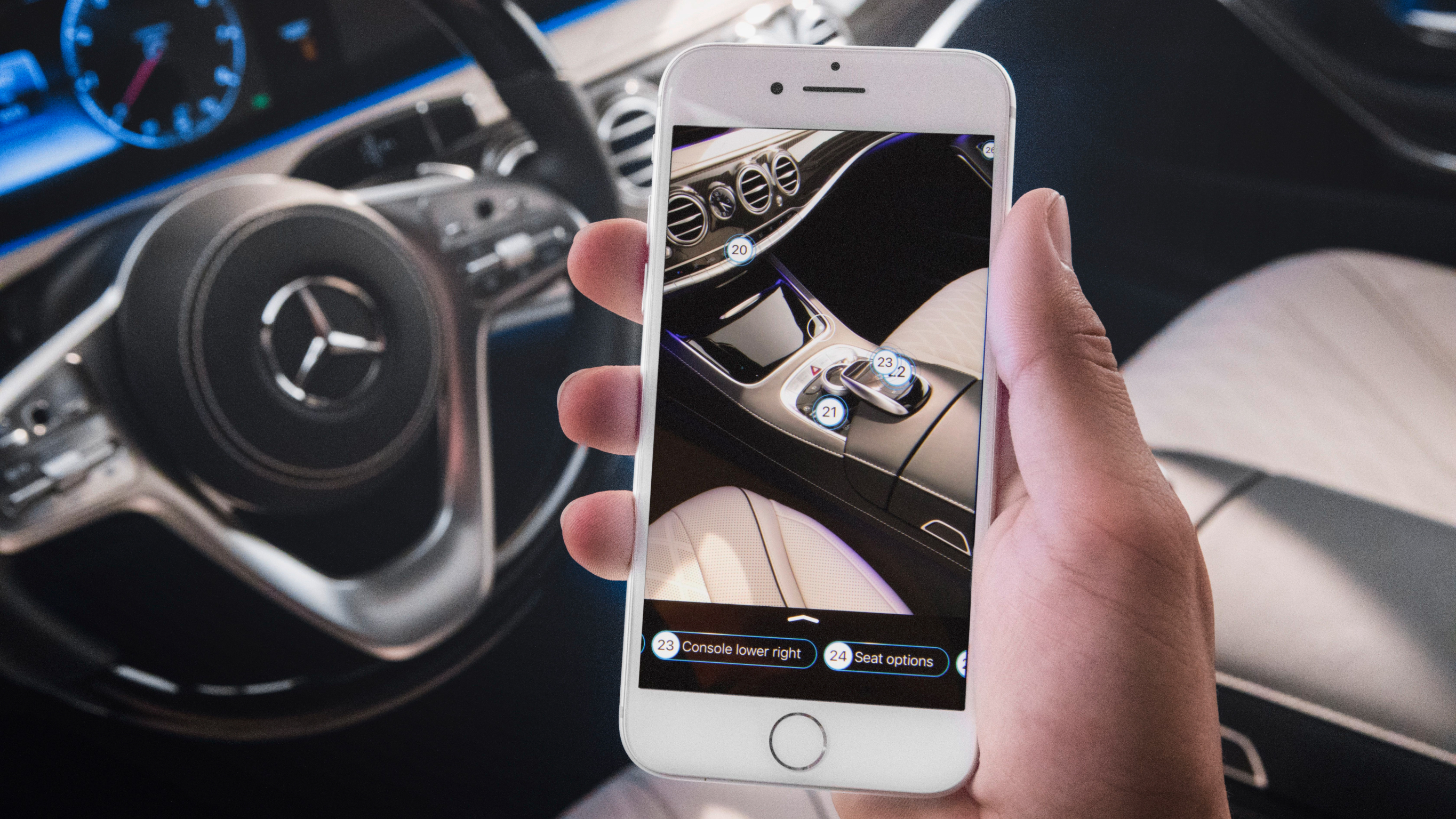 AskMercedes A steering wheel and a mobile phone