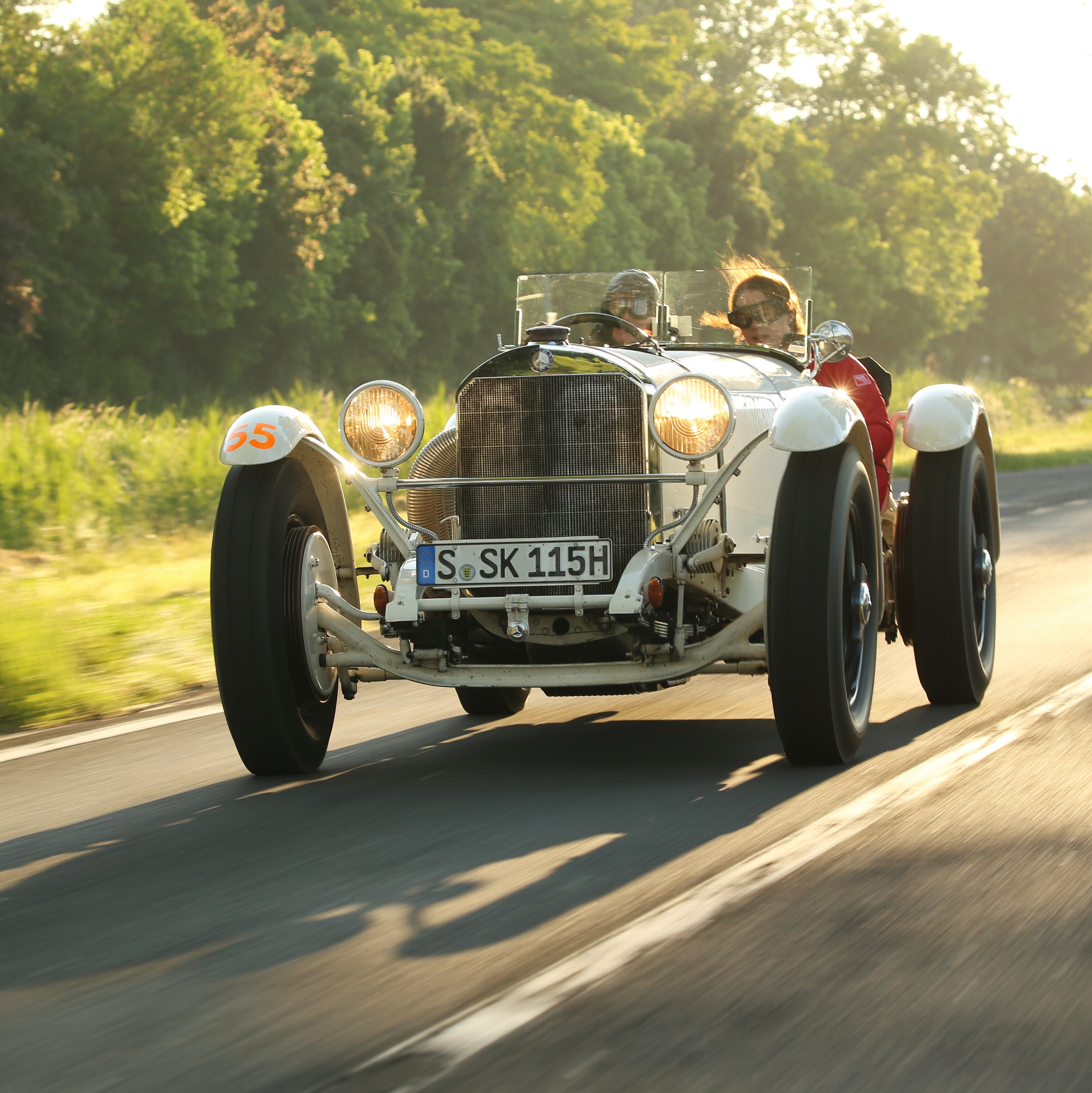 The Mercedes-Benz SSKL driving down a country road