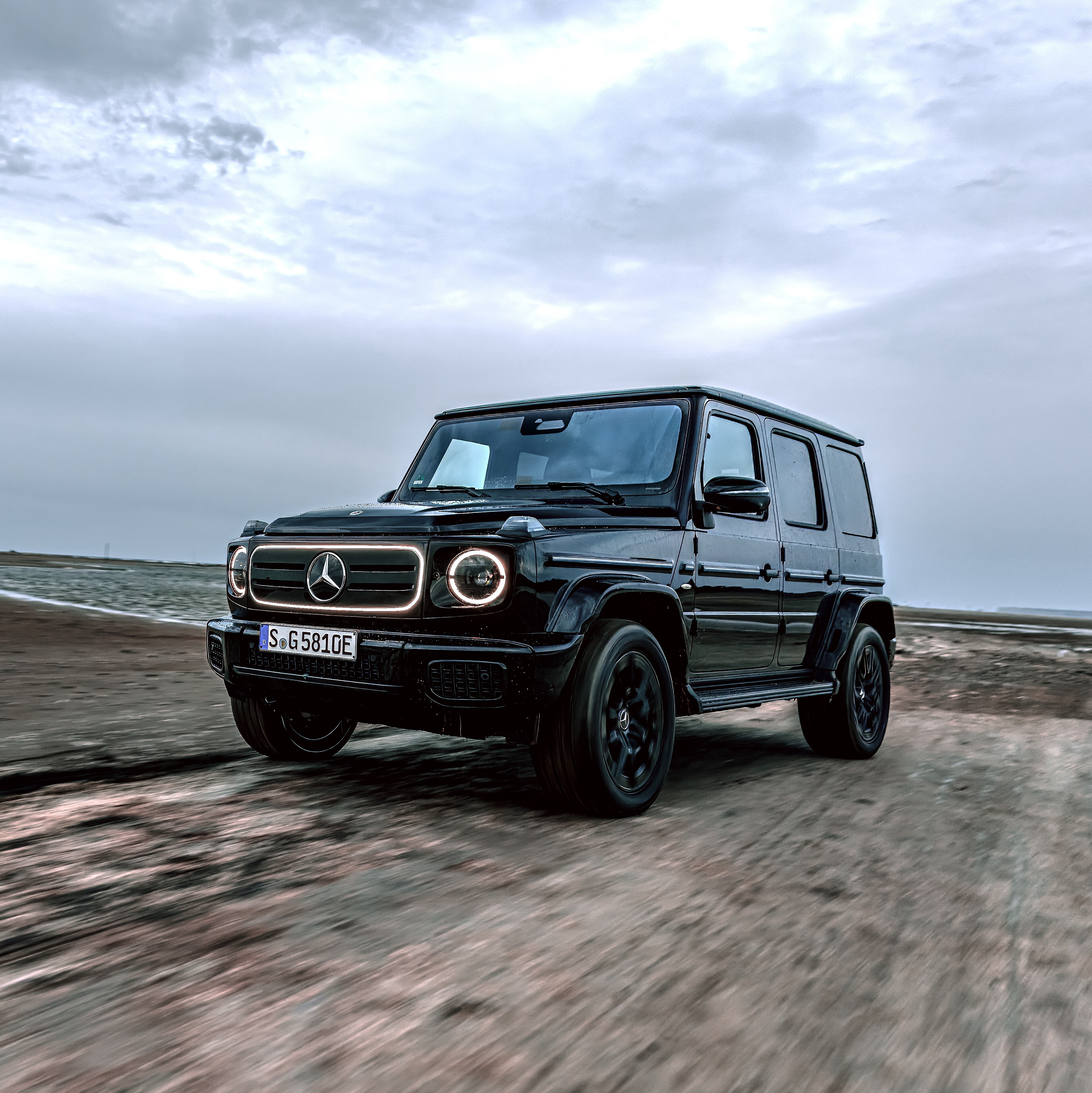 Mercedes-Benz G-Class with EQ Technology driving on a dirt road