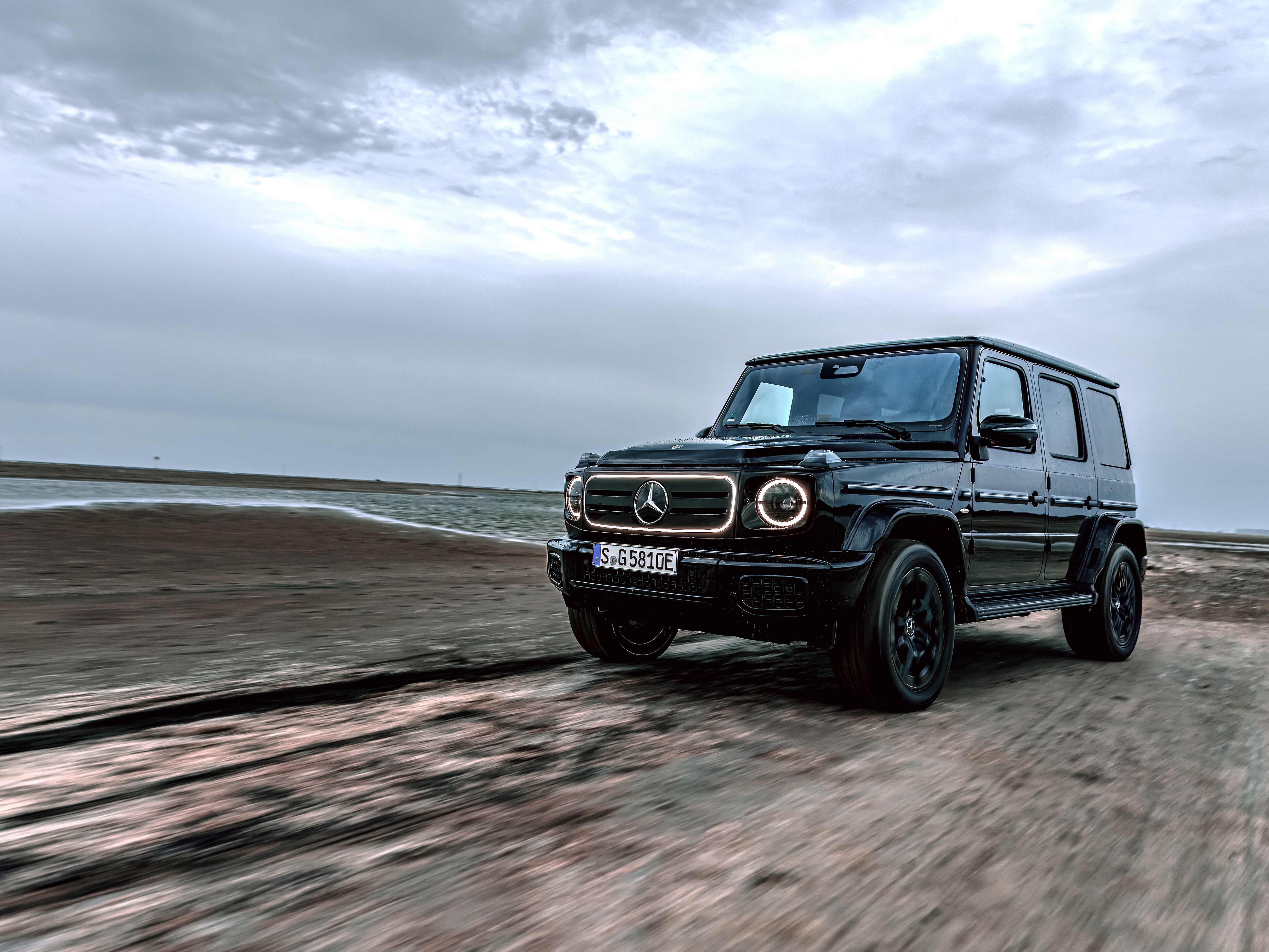 Mercedes-Benz G-Class with EQ Technology driving on a dirt road