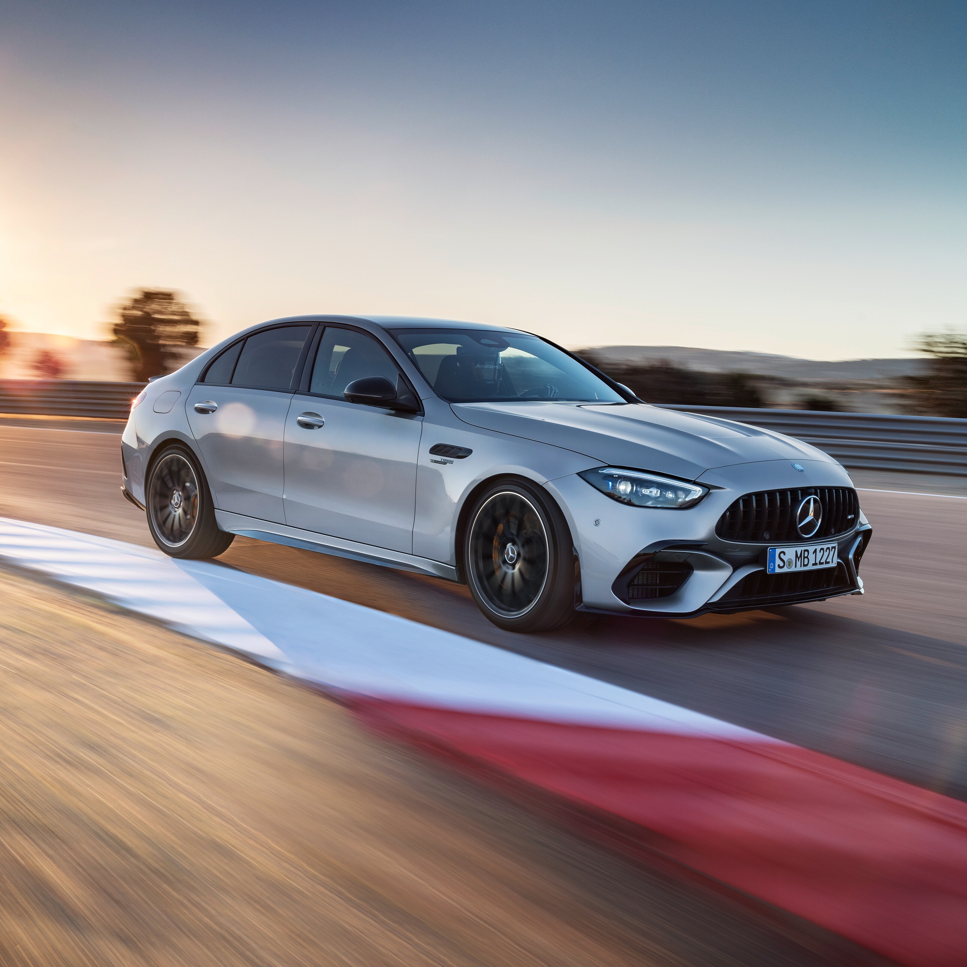 Mercedes-AMG C 63 S E PERFORMANCE driving on a racetrack.
