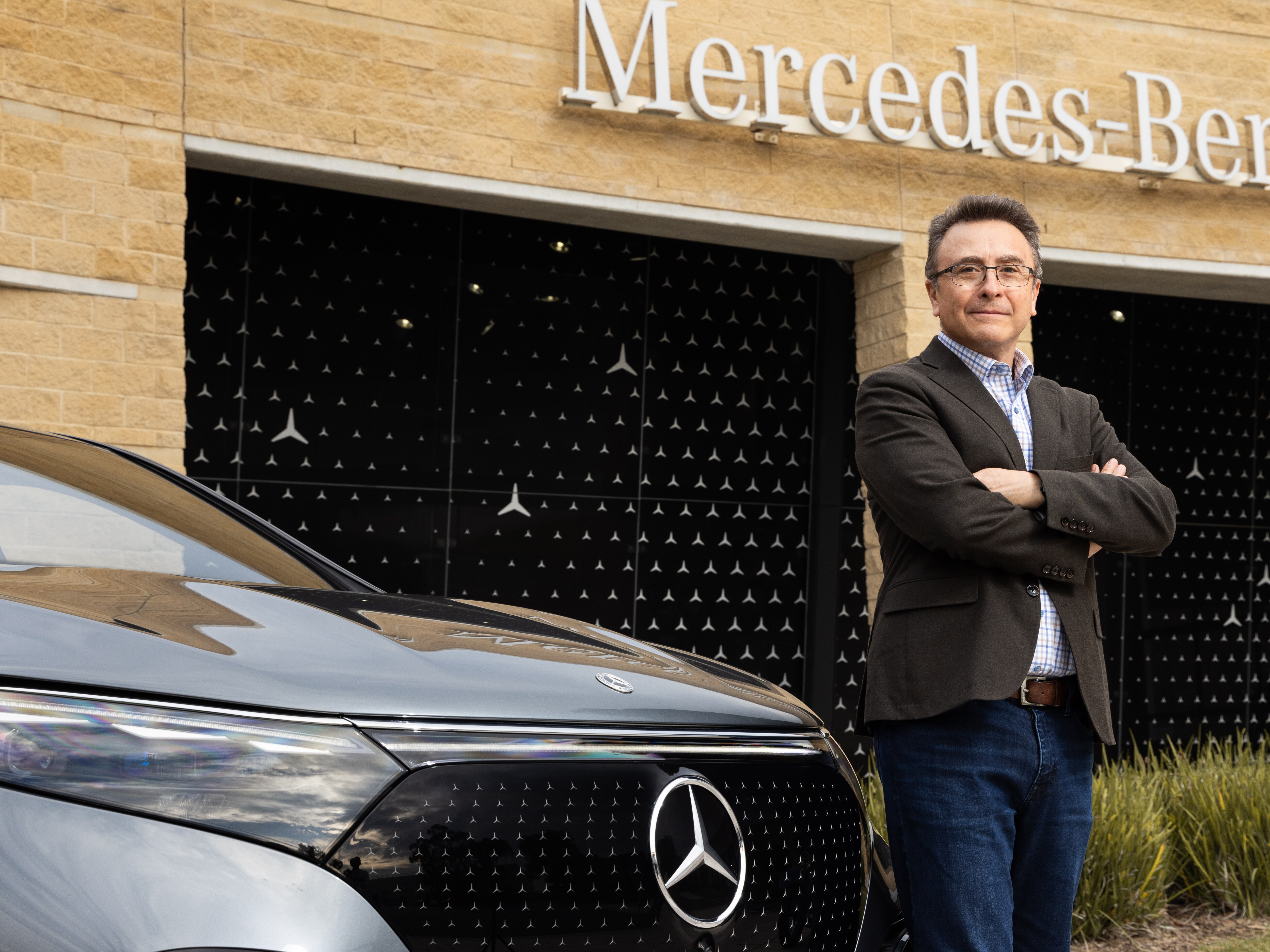 Mercedes-Benz Australia CEO Jaime Cohen next to a Mercedes-Benz vehicle.