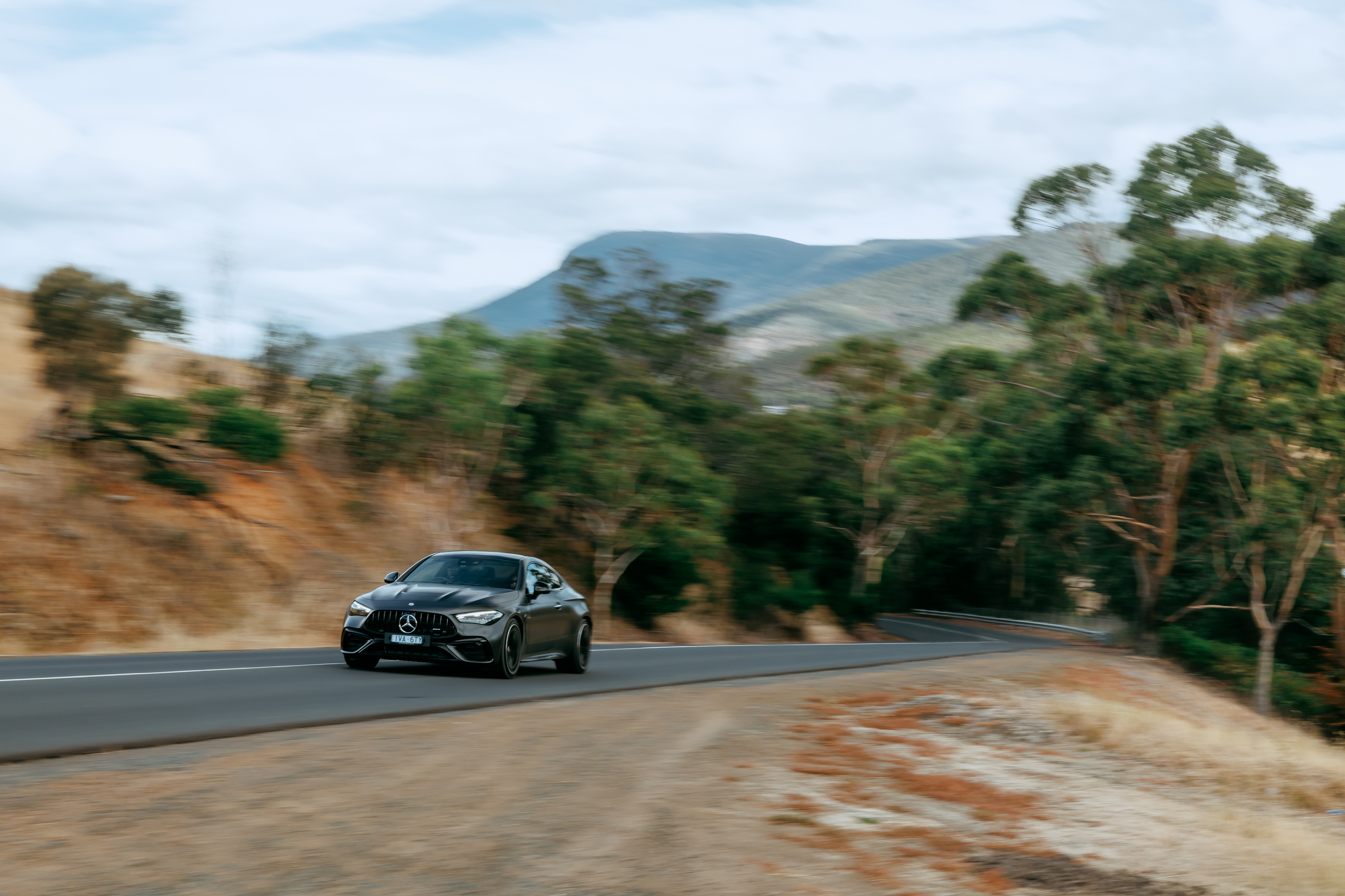 Mercedes-AMG CLE 53 4MATIC Coupé driving on a road. Mercedes-AMG CLE 53 4MATIC Coupé driving on a road. Image credit/photographer: Alastair Brook