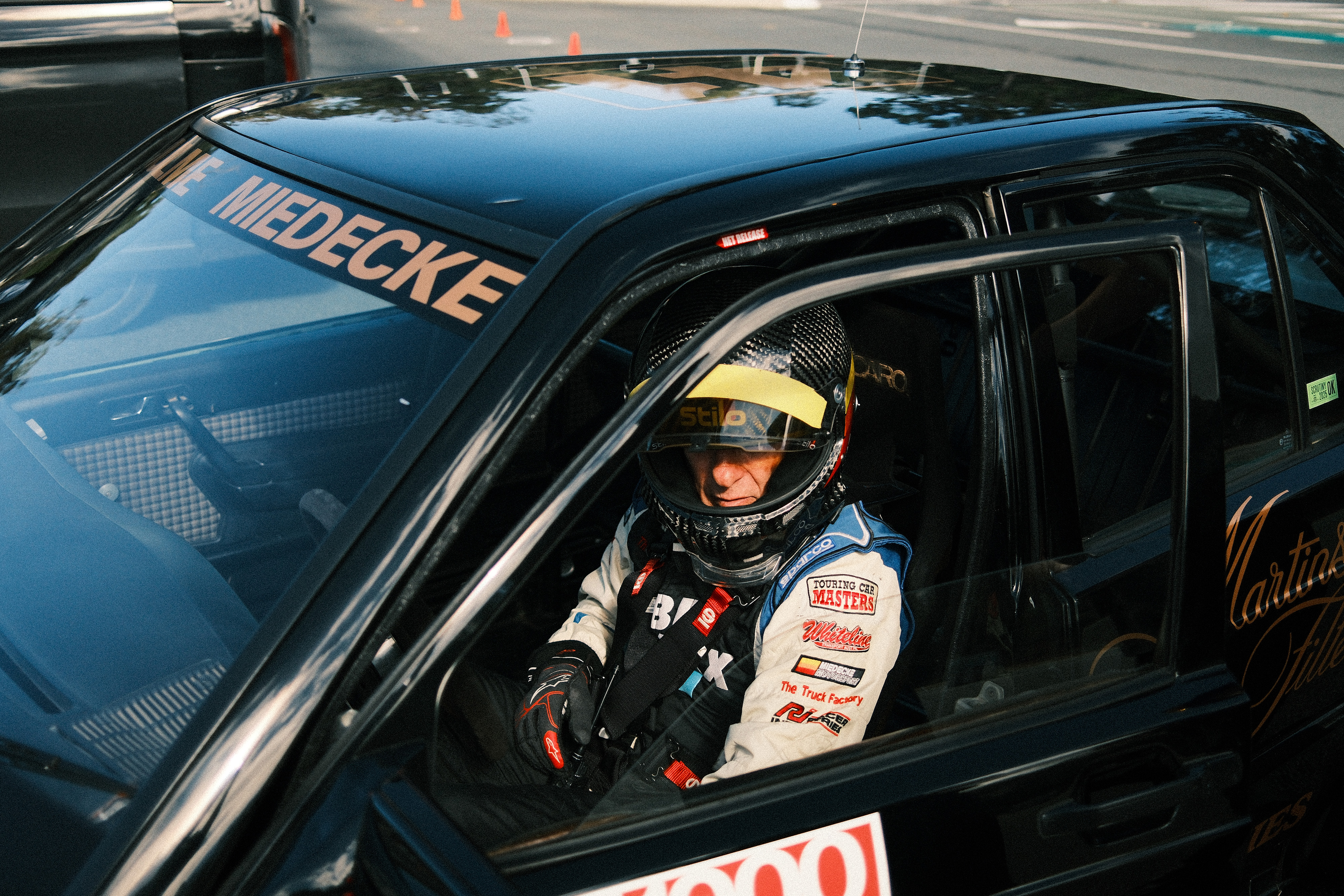 Andrew Miedecke standing inside his restored Mercedes-Benz 190 E 2.3-16 race car Andrew Miedecke standing inside his restored Mercedes-Benz 190 E 2.3-16 race car