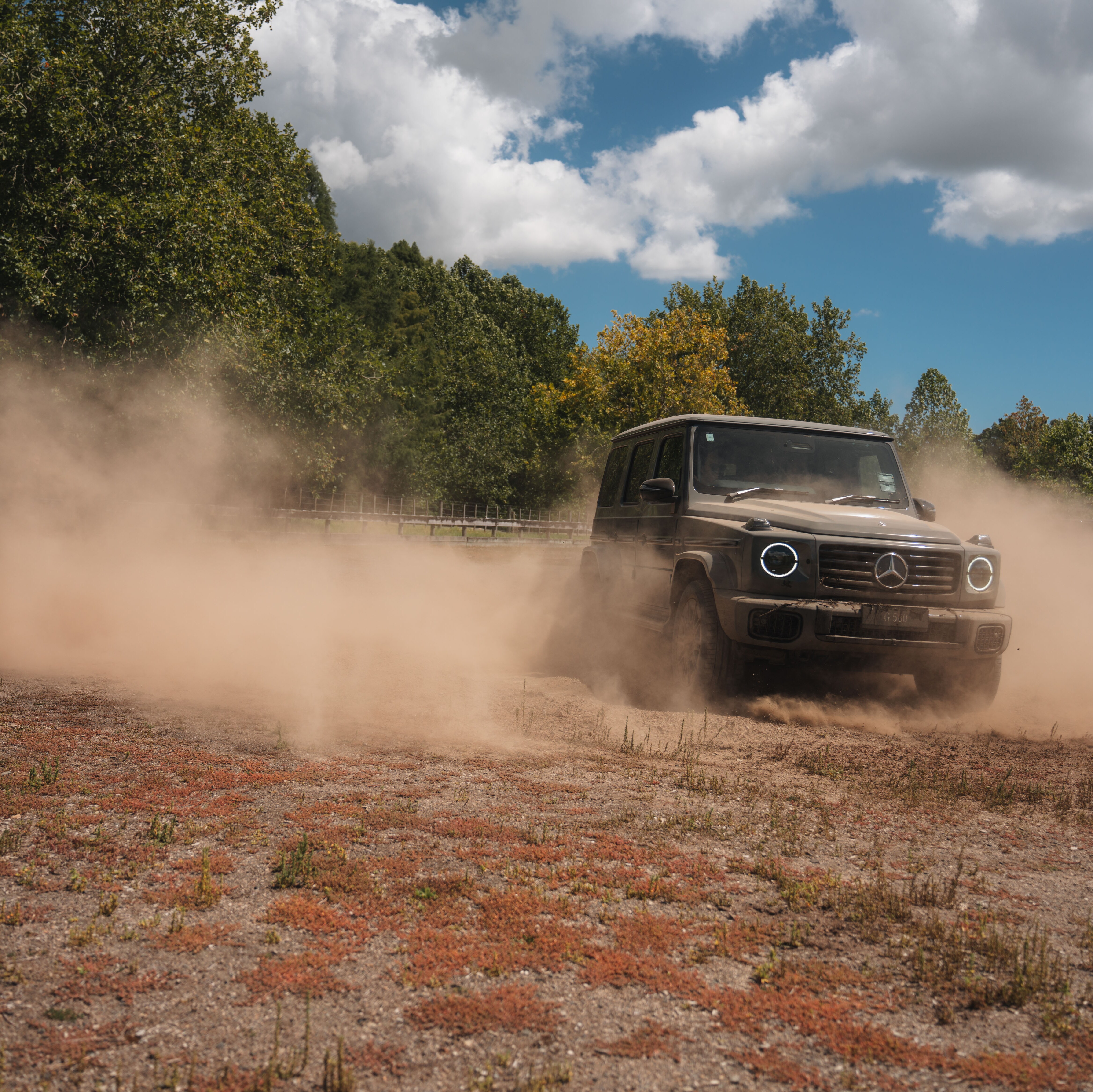 Mercedes-Benz G 580 driving on a dirt road