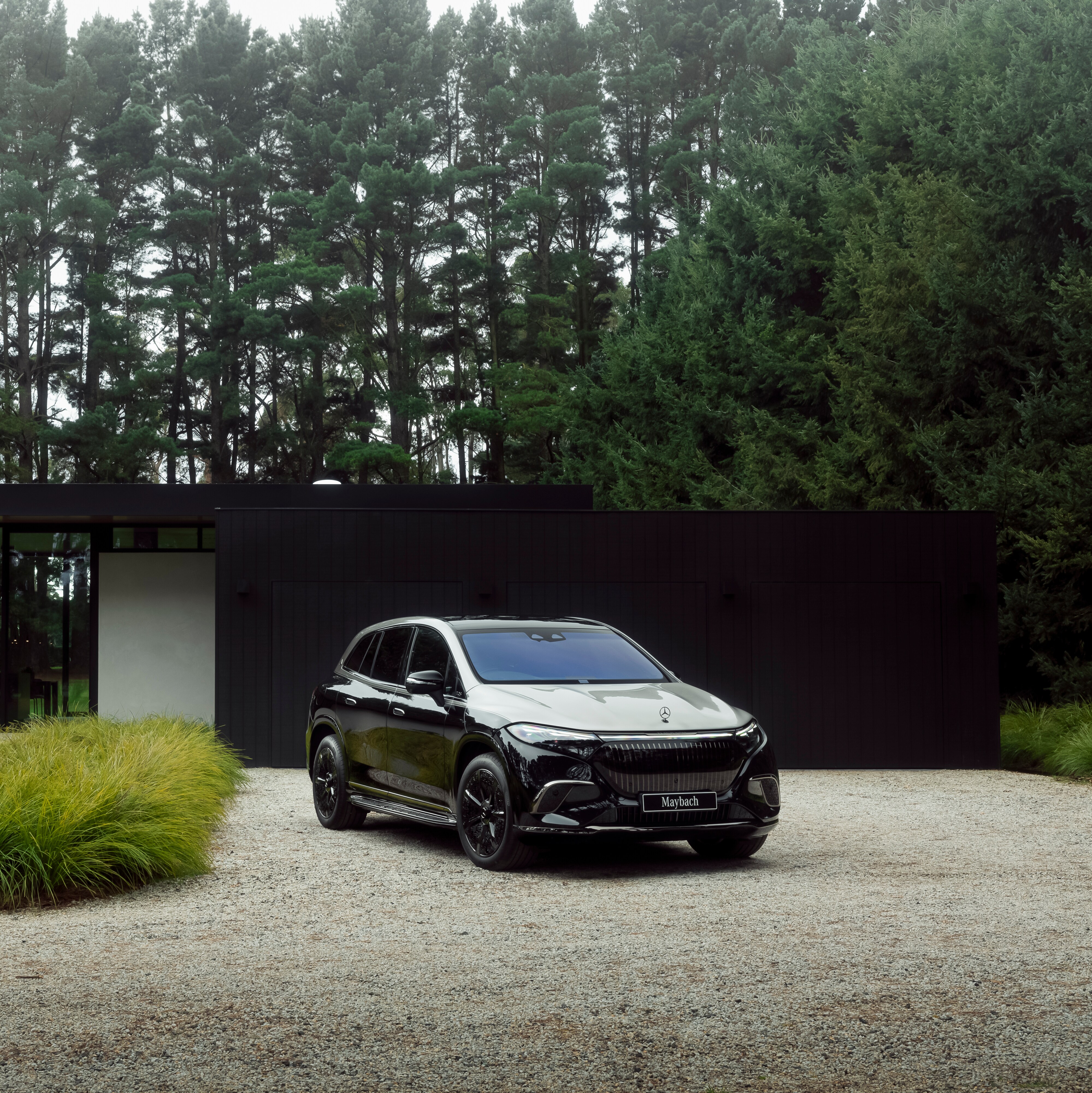 Mercedes-Maybach EQS SUV parked in a driveway.