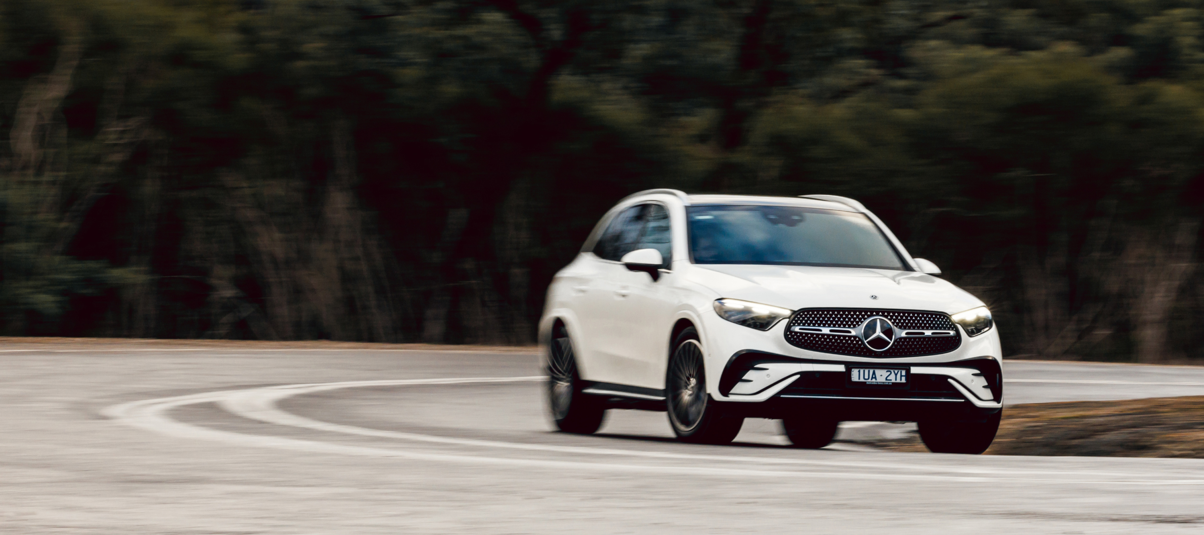Mercedes-Benz GLC 300 4MATIC A white Mercedes-Benz GLC 300 4MATIC driving on a country road. Image credit/photographer: Stephen Dwight