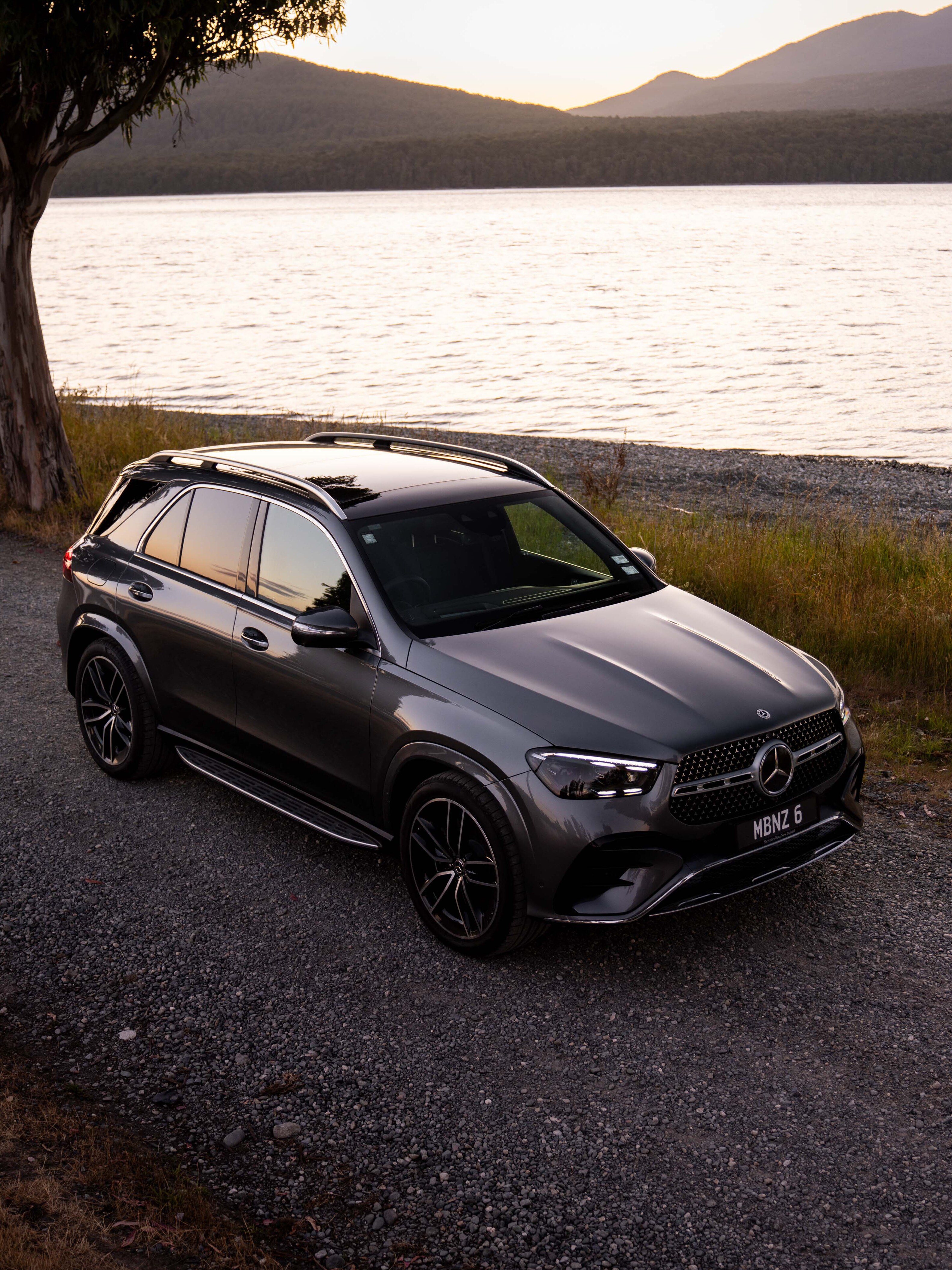 GLE SUV parked beside a pictureque river view