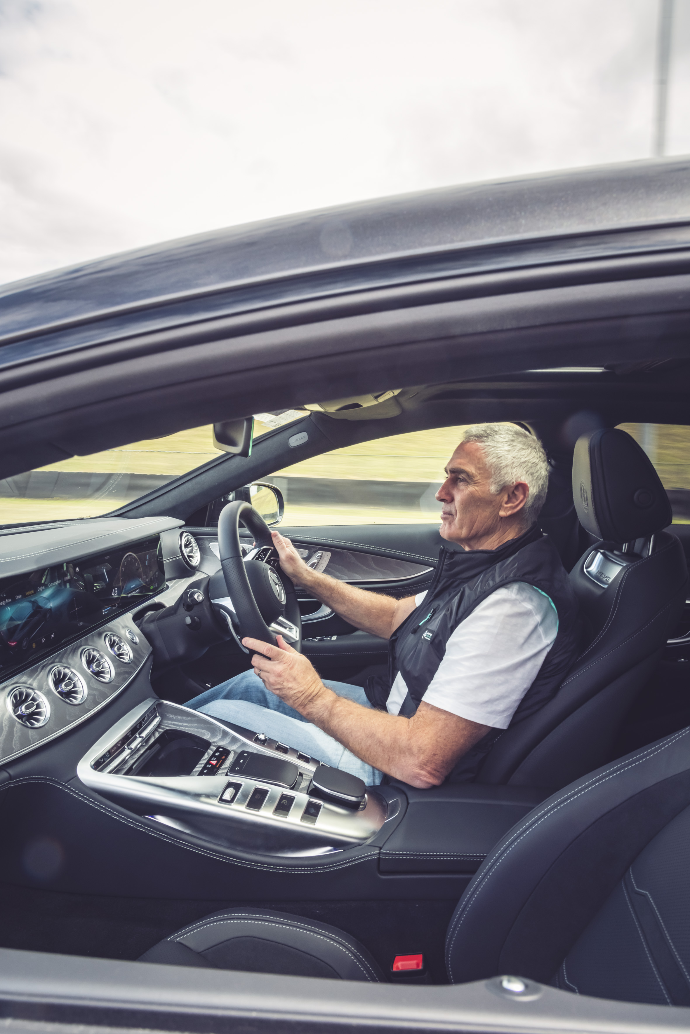Mick Doohan standing next to a Mercedes-AMG GT 63 S E PERFORMANCE at Sydney Motorsport Park. Mick Doohan standing next to a Mercedes-AMG GT 63 S E PERFORMANCE at Sydney Motorsport Park.