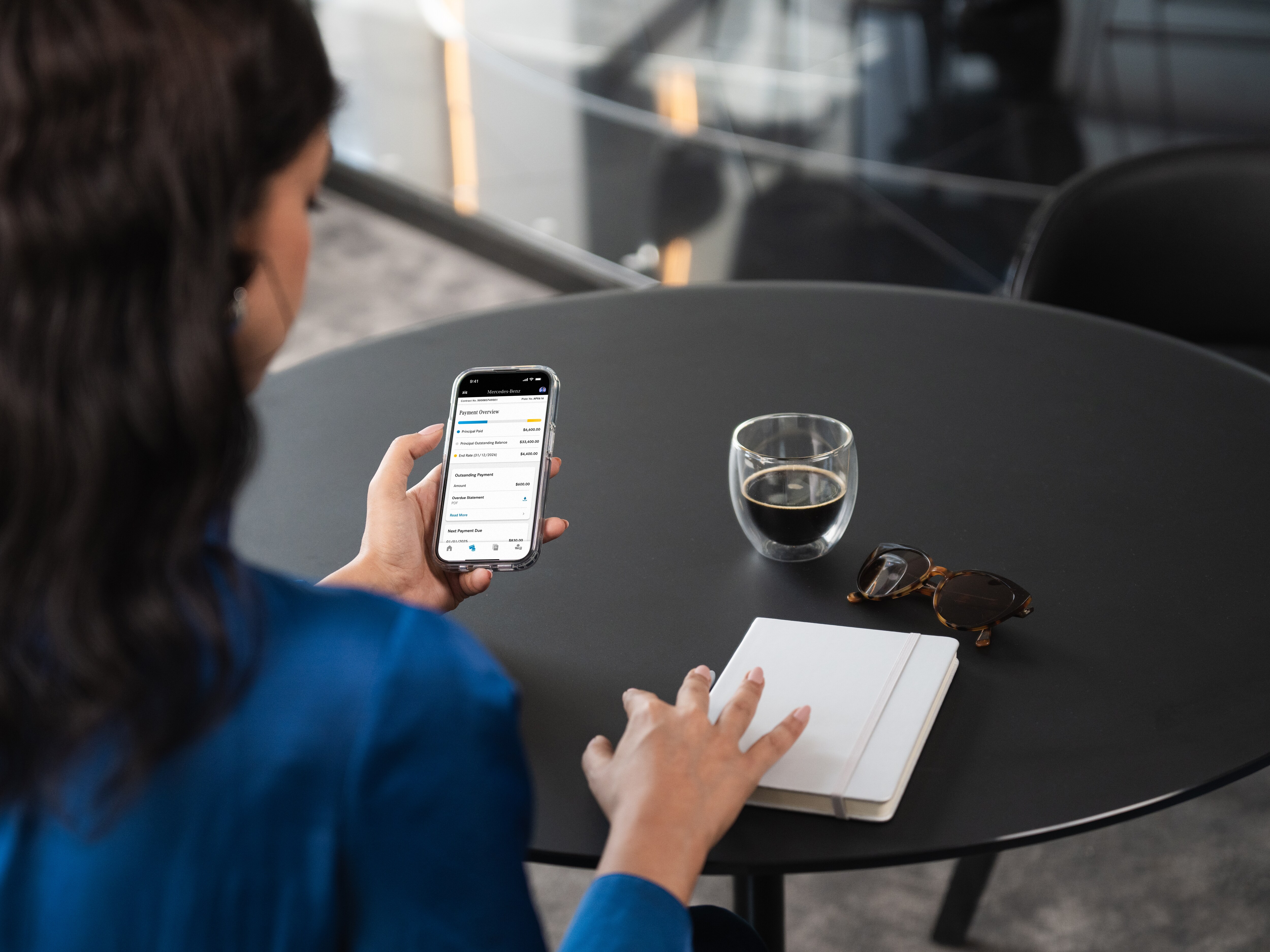 Person reviewing finance contract details on phone