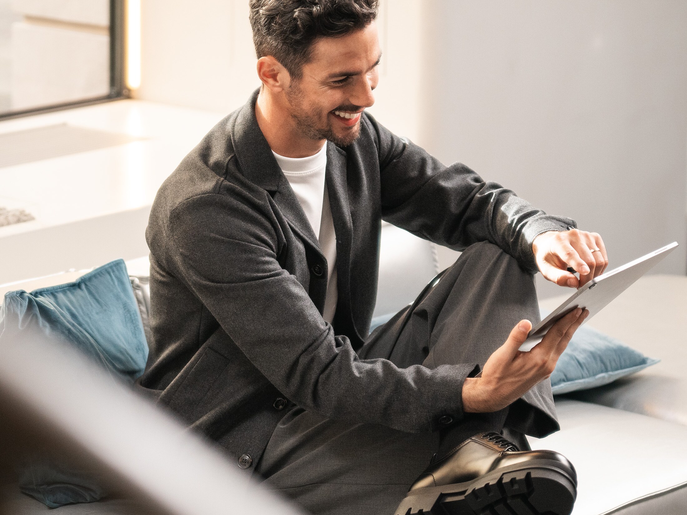 A person on their tablet using the Mercedes-Benz Finance App.