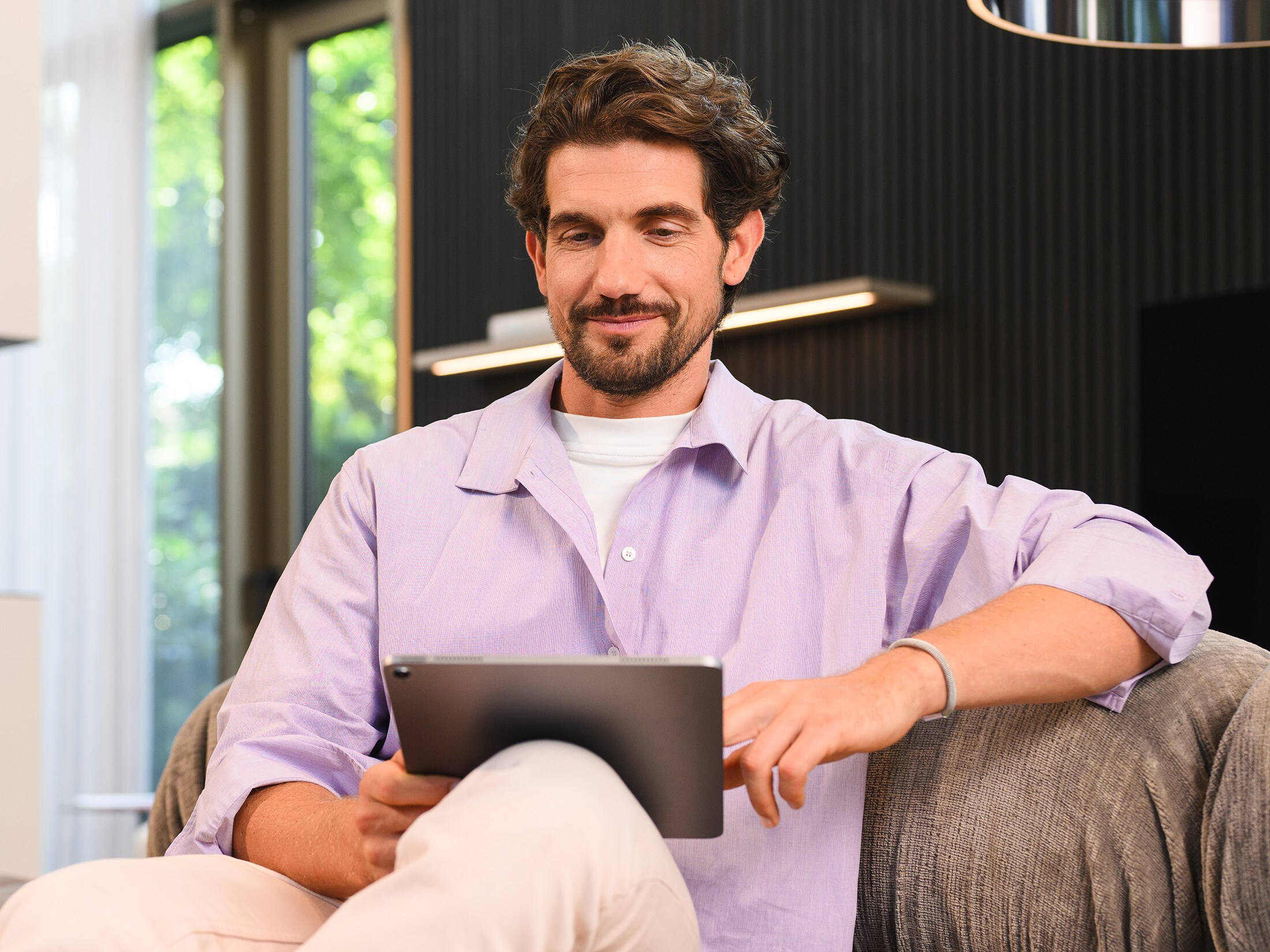 Man looking at his tablet