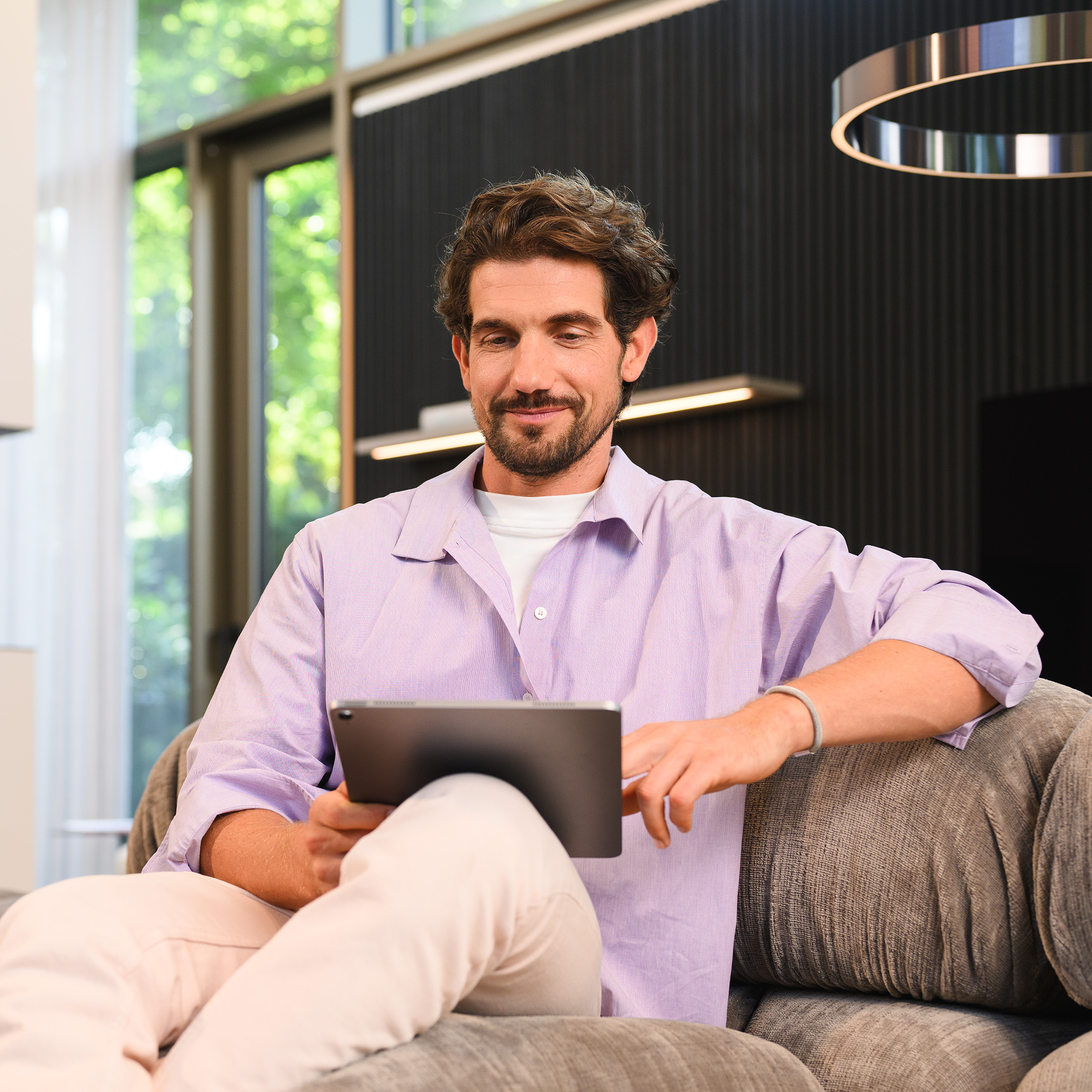 Man looking at his tablet Man looking at his tablet