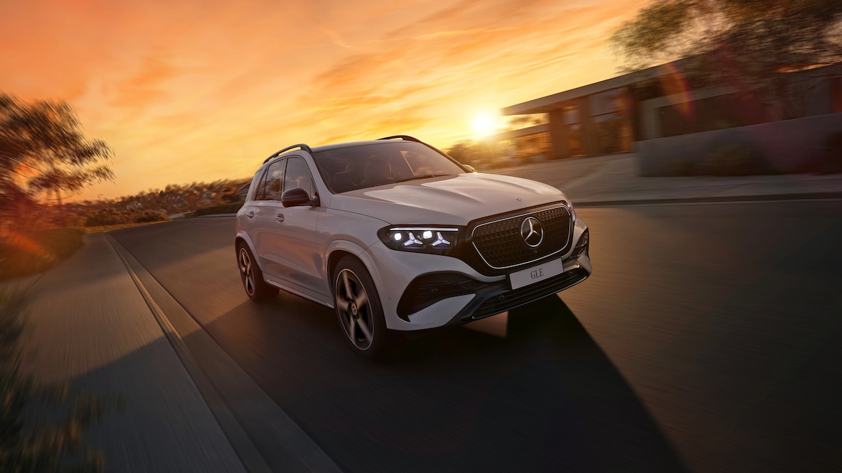 The illuminated outline around the radiator grille and distinctive star design headlights from the Mercedes-Benz GLE.