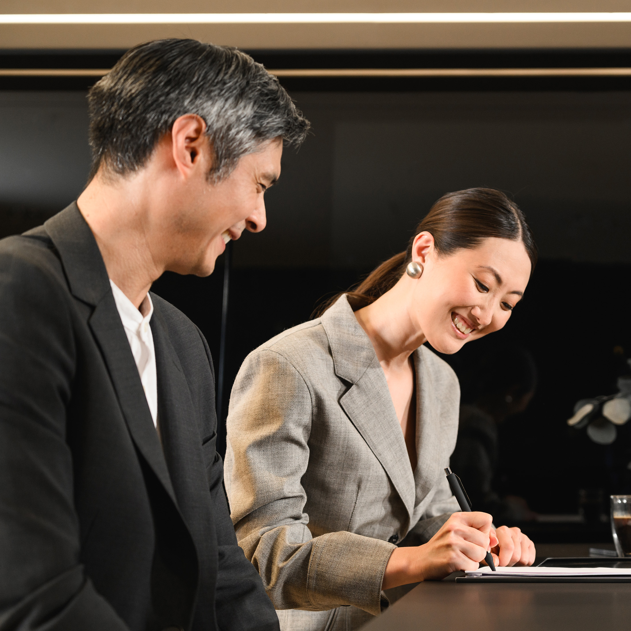 Insurance | Financial Services | Mercedes-Benz Family preparing their blue Mercedes-Benz EQC for a trip