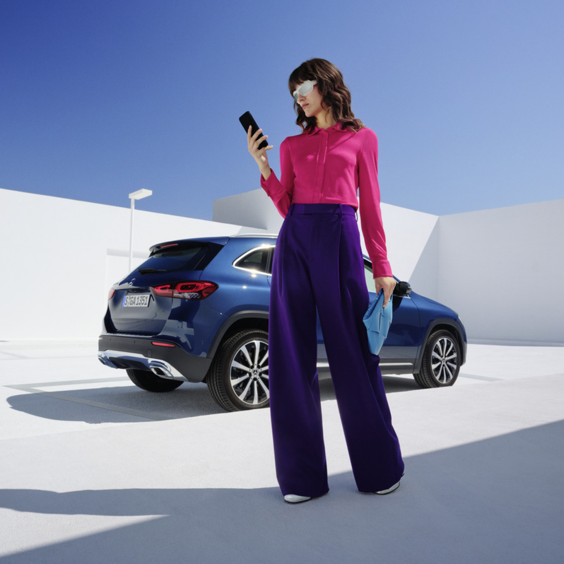 Monthly subscription option for your Digital Extras A woman holding a mobile phone