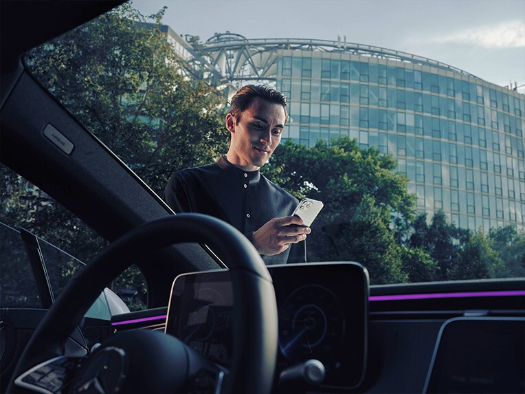 View of man with phone from inside of van