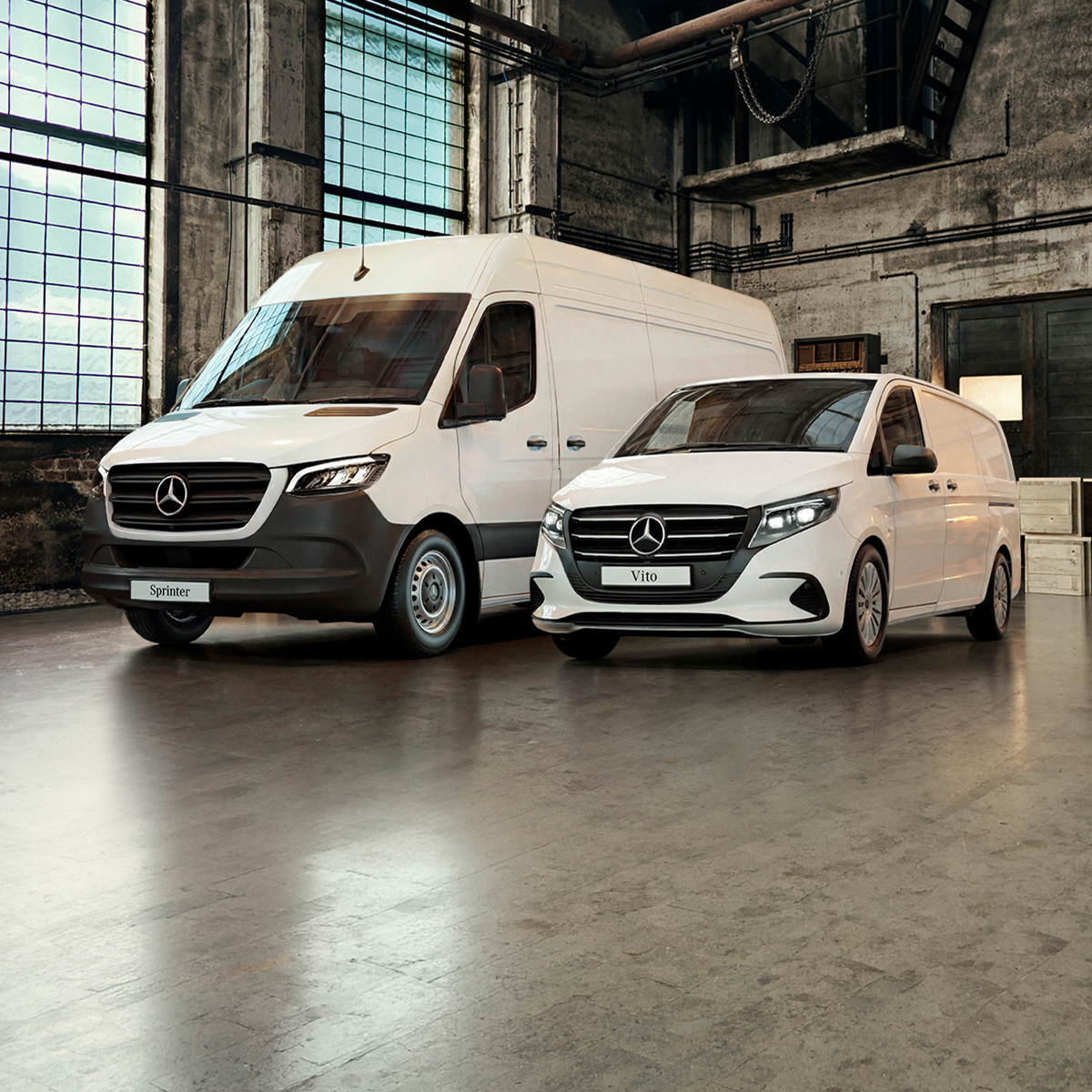 of a a vintage black horse-drawn carriage next to a white Mercedes-Benz van parked indoors