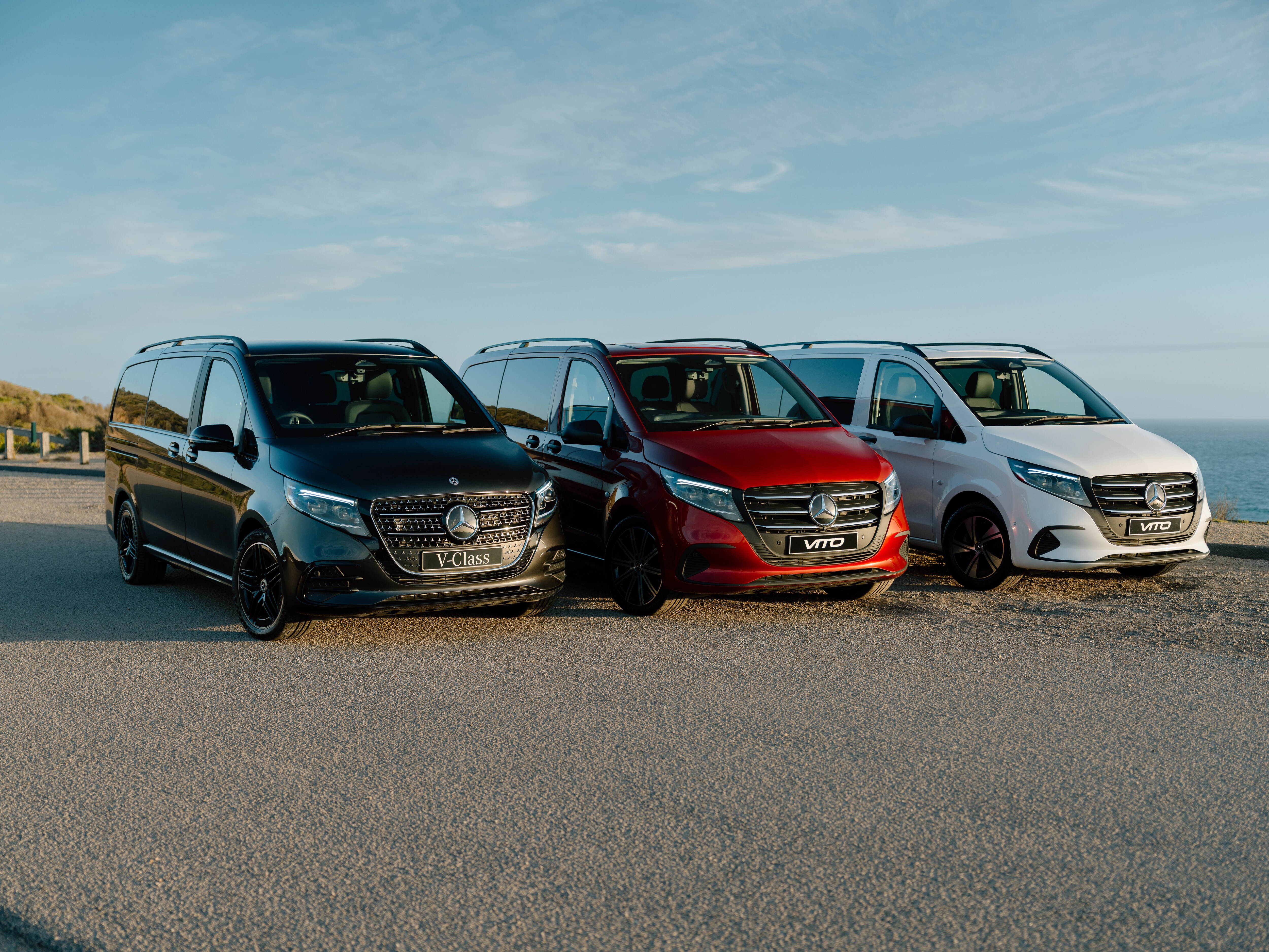 A group of Mercedes-Benz vans parked in a row