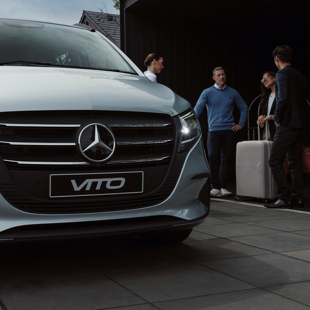 A group of people getting ready to get into a van