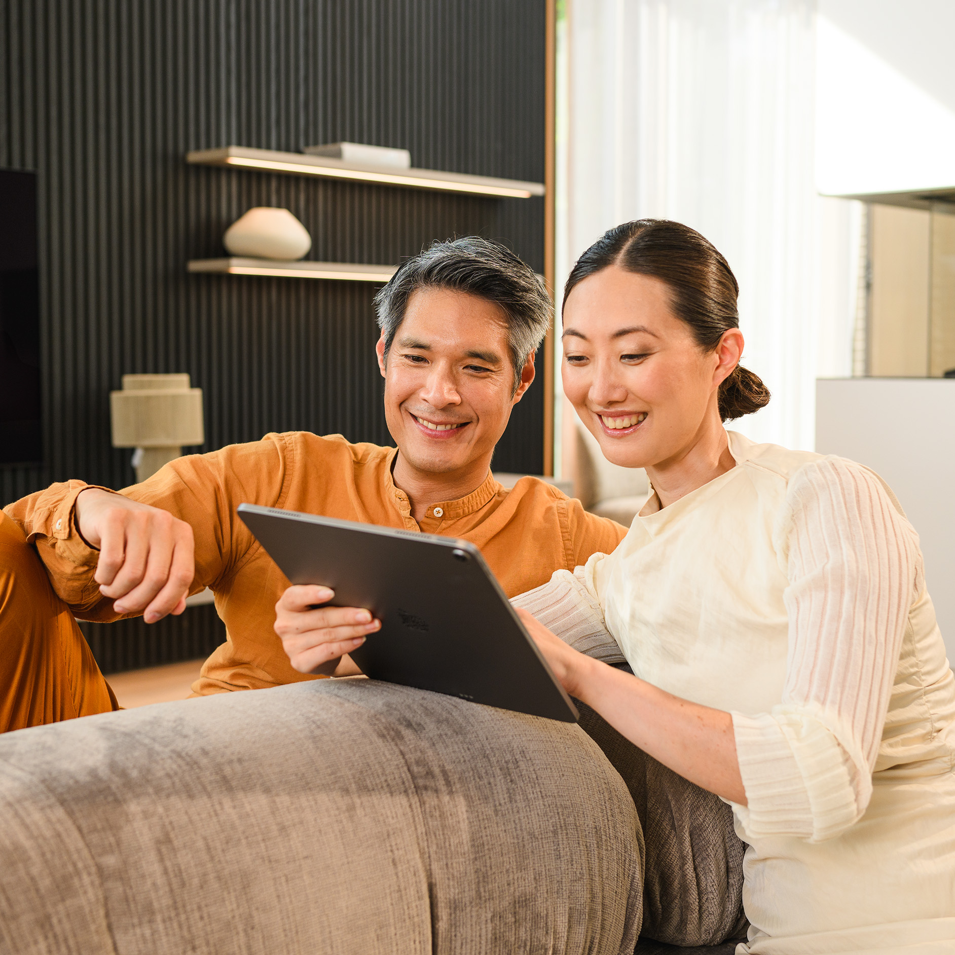 Finance Calculator A couple looking at the tablet