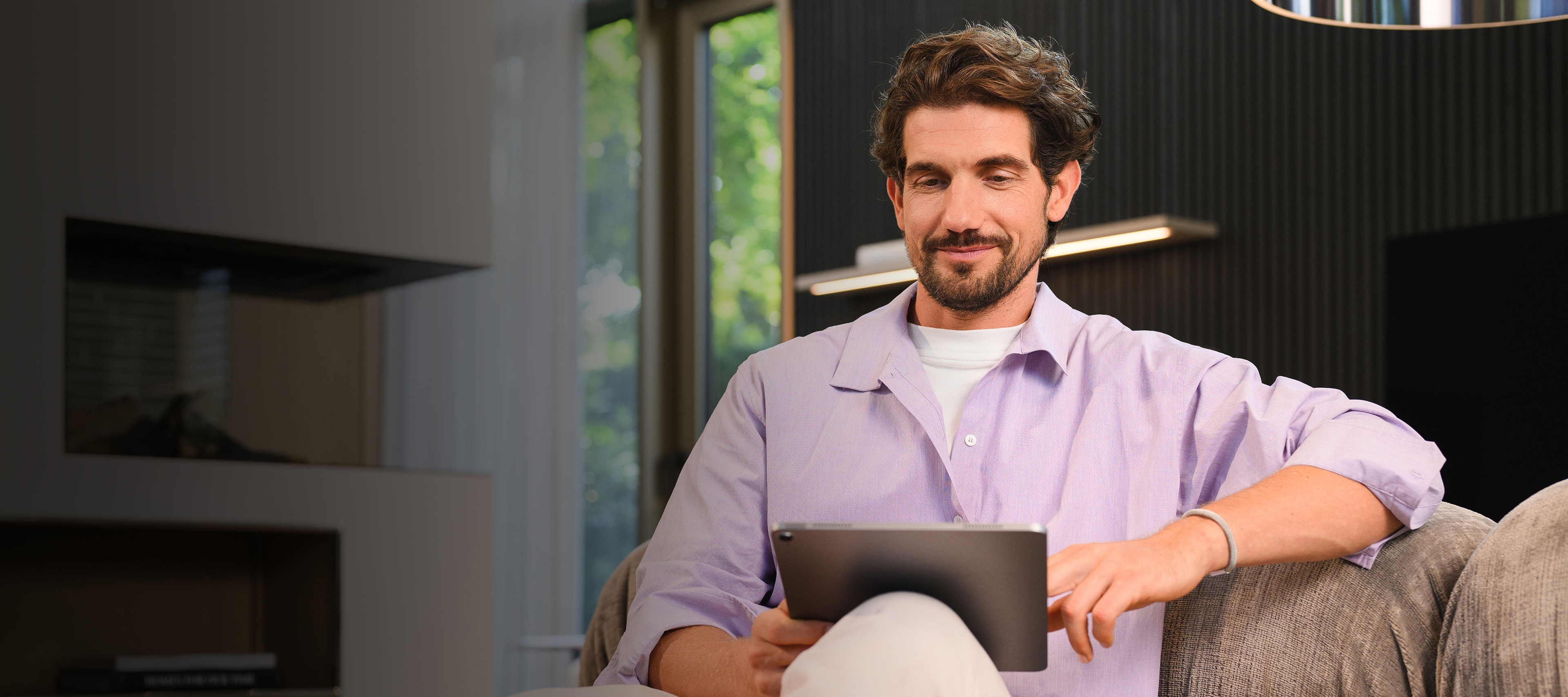 Optimal cover for your Mercedes-Benz Van with Mercedes- Benz Insurance A person on his tablet looking Mercedes-Benz Insurance options for his Mercedes-Benz Van