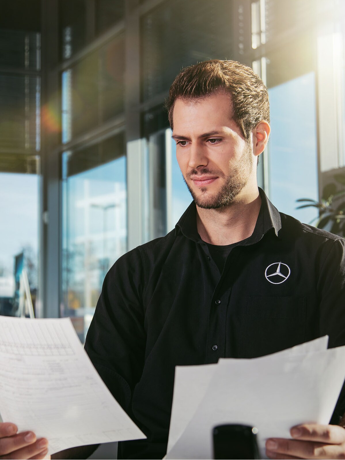 A man holding some documents