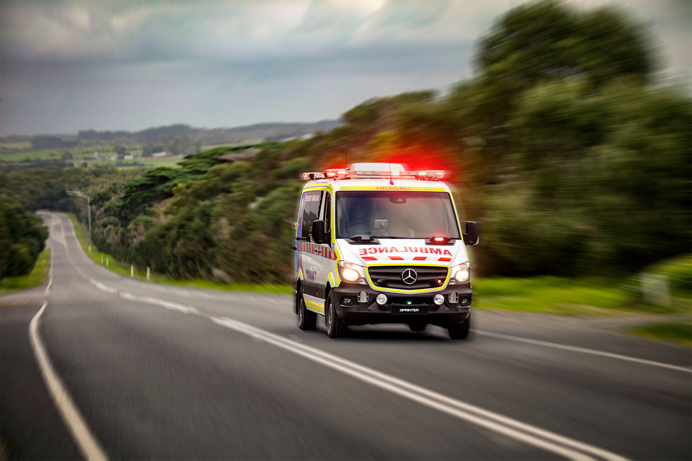 Industry programs | Patient transport Ambulance on the road