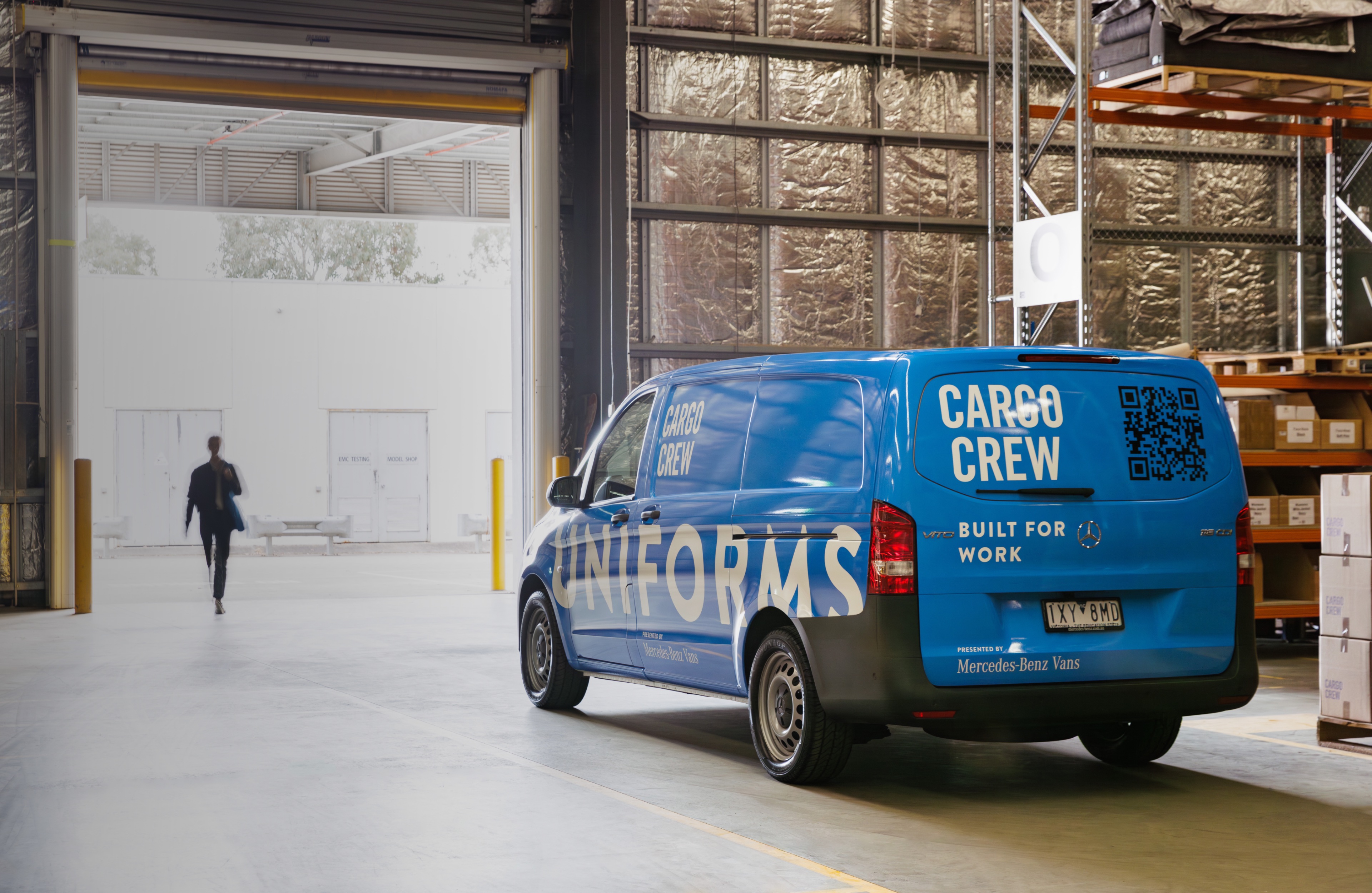 Cargo Crew A blue van parked in front of roller door with person walking through. Image credit/photographer: XMEDIA