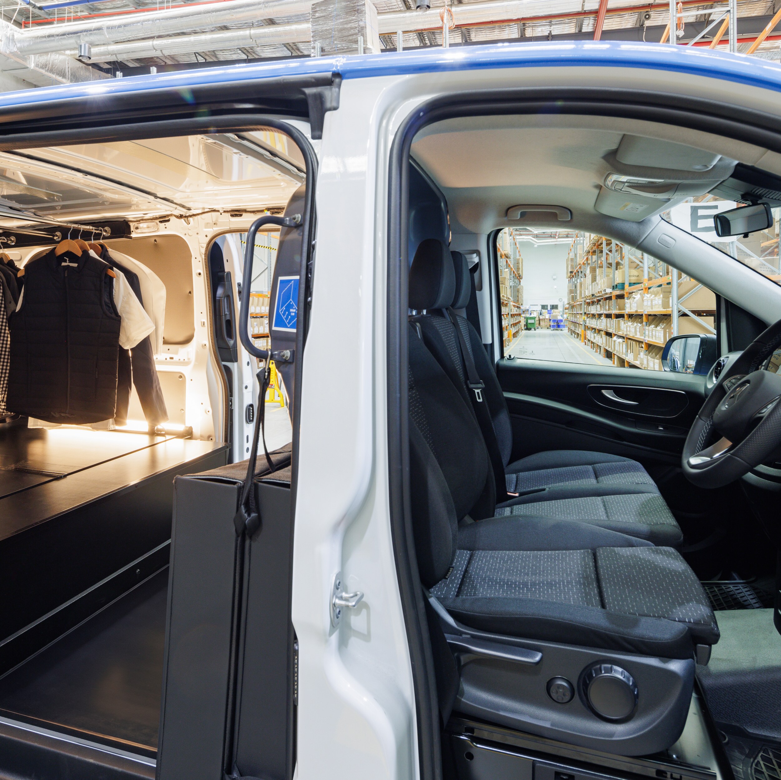 Shirts on a rack inside tha back of a van. Image credit/photographer: XMEDIA  
