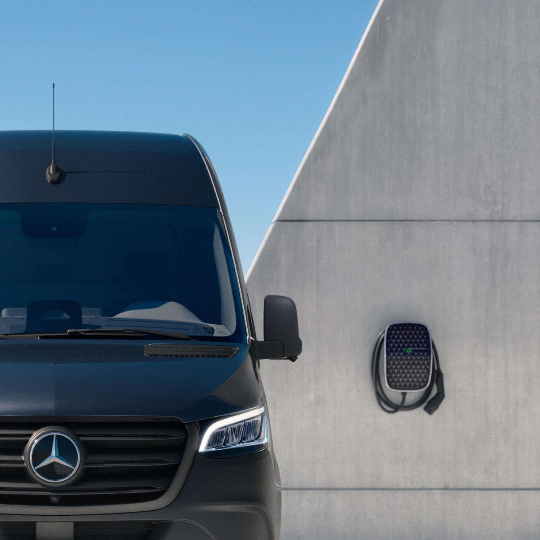A Mercedes-Benz van next to a Wallbox