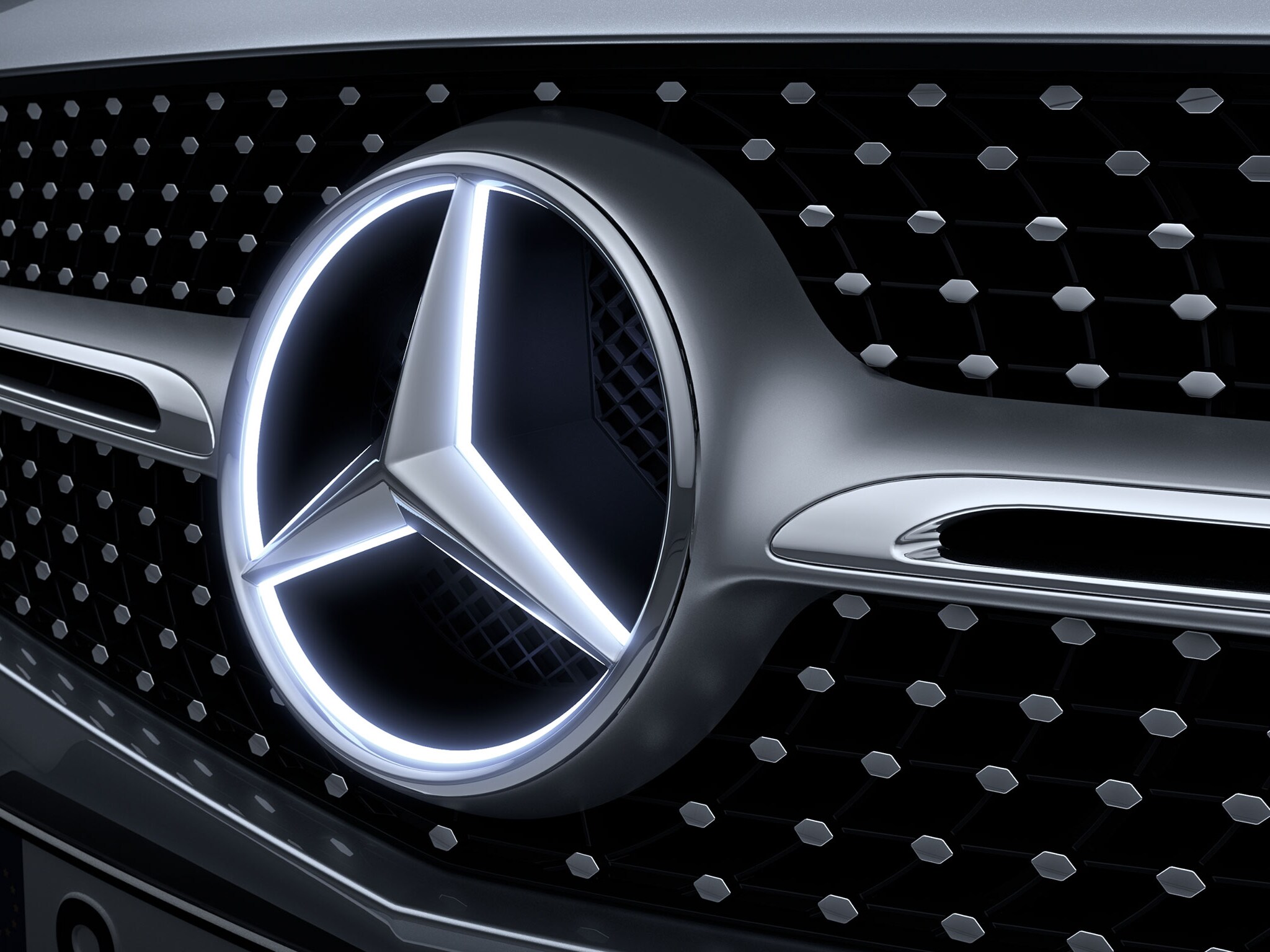 The image shows a close-up of a Mercedes-Benz star.