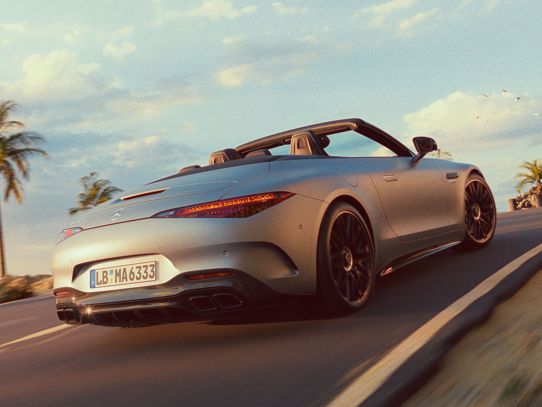 A side view of the Mercedes-AMG SL Roadster driving on the street.